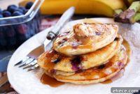 Fluffy Banana Blueberry Pancakes with Warm Cinnamon Vanilla Butter