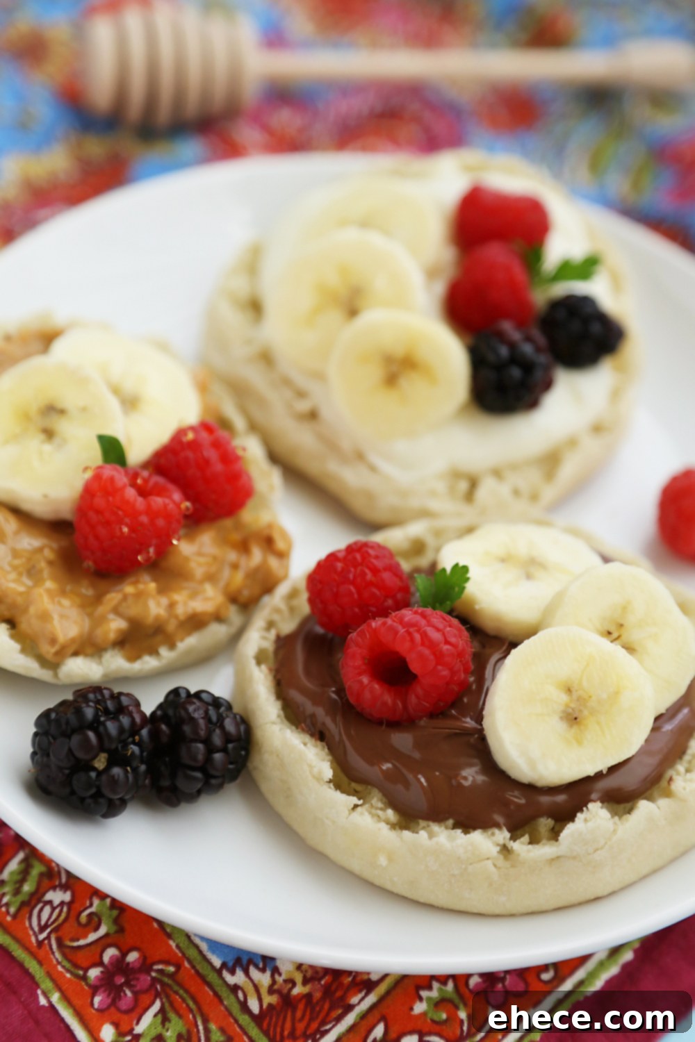 English Muffin Fruit Breakfast Pizzas - Spread with yogurt, Nutella or peanut butter and top with fresh fruit for a delicious morning treat! thecomfortofcooking.com