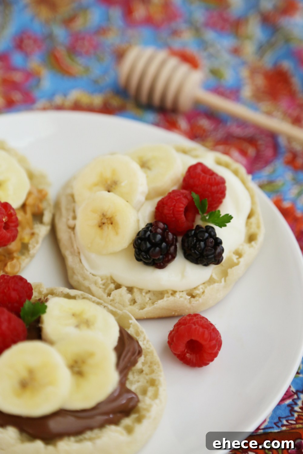 English Muffin Fruit Breakfast Pizzas - Spread with yogurt, Nutella or peanut butter and top with fresh fruit for a delicious morning treat! thecomfortofcooking.com