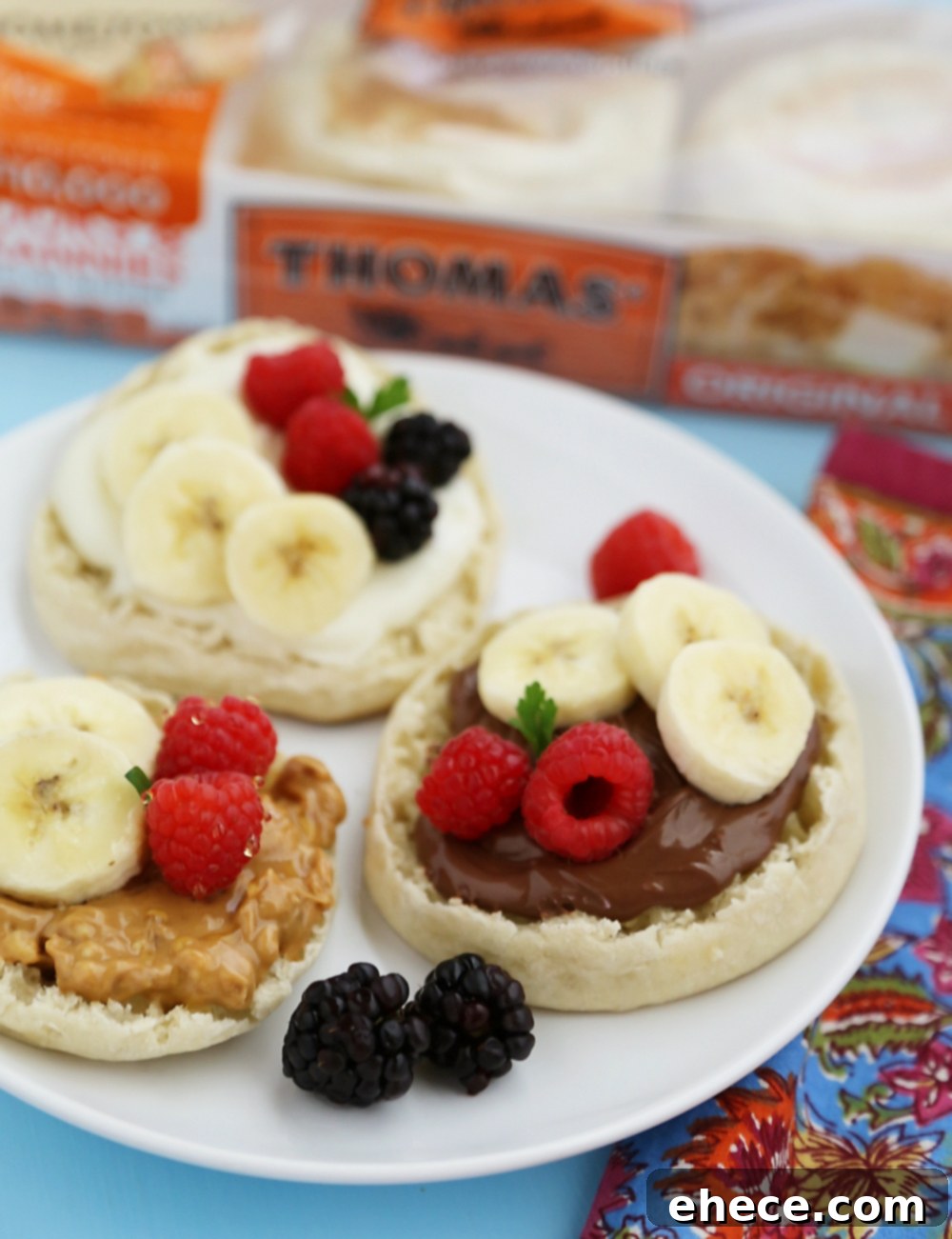 English Muffin Fruit Breakfast Pizzas - Spread with yogurt, Nutella or peanut butter and top with fresh fruit for a delicious morning treat! thecomfortofcooking.com