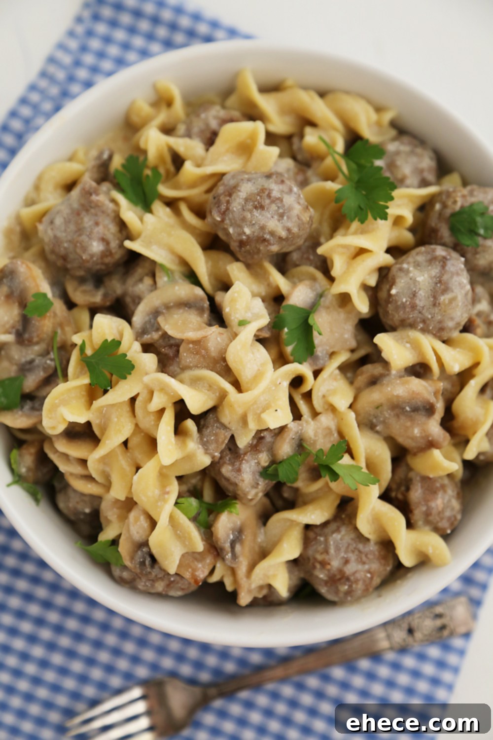 Delicious Creamy Mushroom Meatball Stroganoff ready to be served – a super creamy, homemade dish with fresh mushrooms and hearty meatballs.