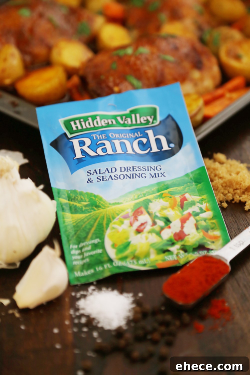 Sheet Pan Garlic Ranch Chicken and Roasted Vegetables 3 Close-up of golden brown roasted chicken thighs and caramelized carrots on a baking sheet