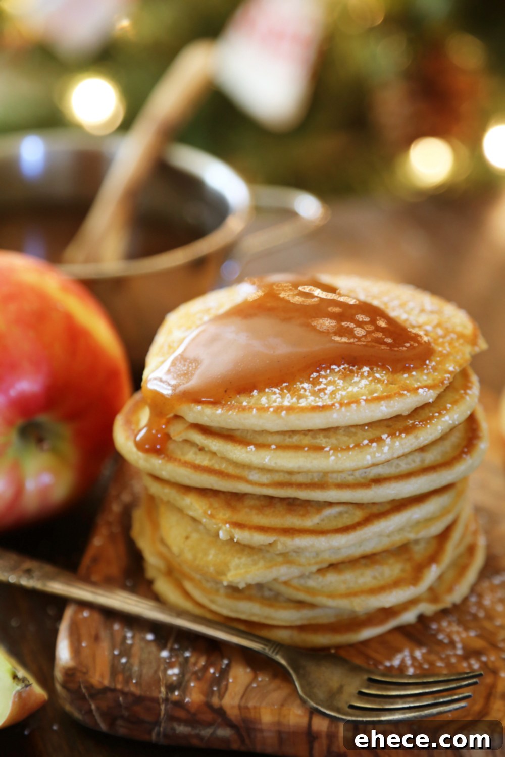 Easy Homemade Apple Cider Syrup – Velvety rich, cinnamon-spiced syrup is perfect on hot pancakes, waffles or French toast. Use in any recipe that calls for maple syrup + give as gifts! Thecomfortofcooking.com