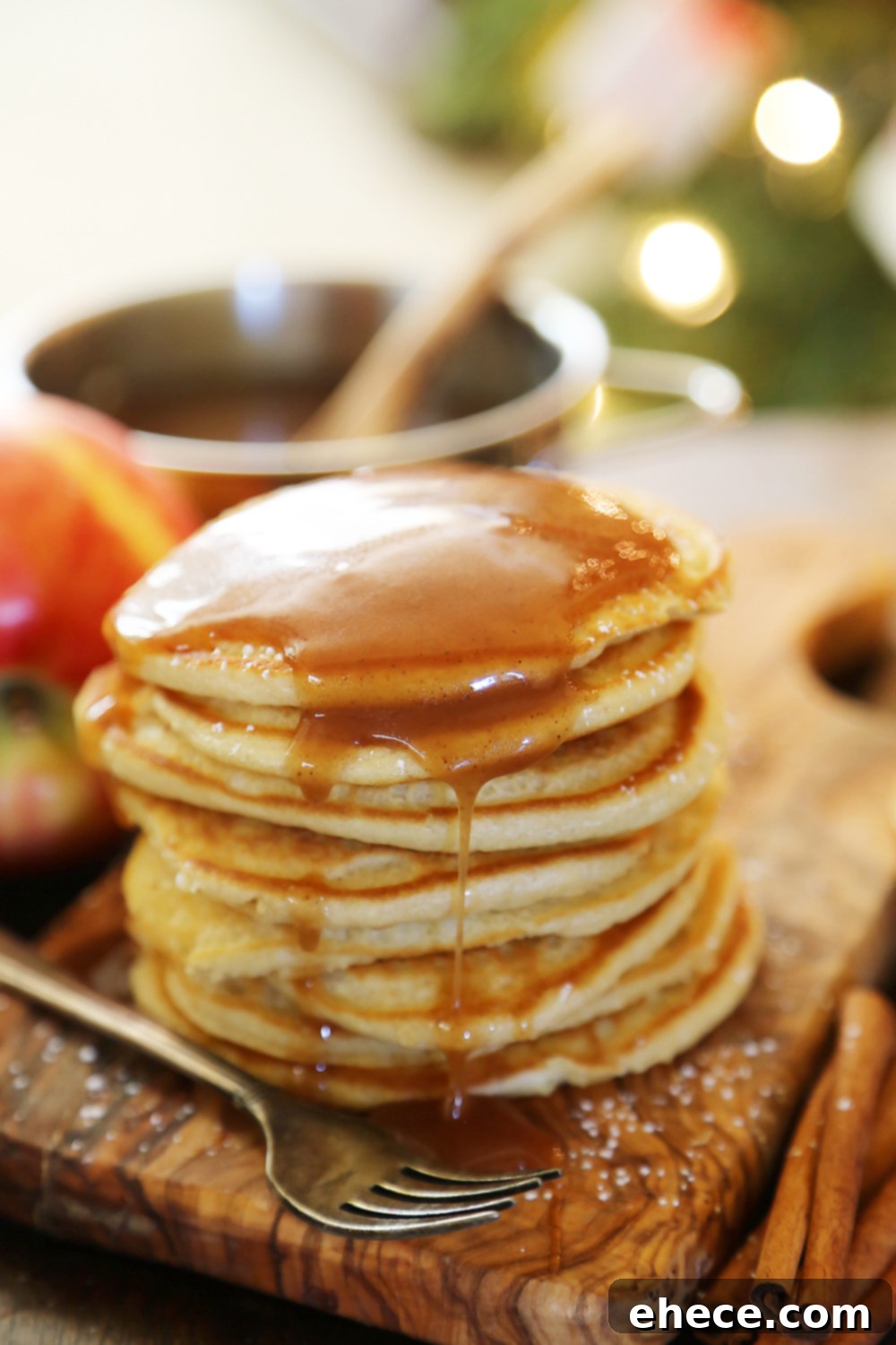 Easy Homemade Apple Cider Syrup – Velvety rich, cinnamon-spiced syrup is perfect on hot pancakes, waffles or French toast. Use in any recipe that calls for maple syrup + give as gifts! Thecomfortofcooking.com