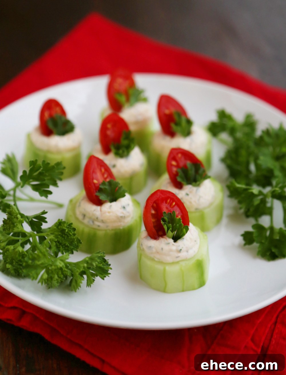 Fresh Cucumber Tomato Bites with Creamy Parmesan Herb Spread - An easy, healthy appetizer perfect for holiday parties, summer gatherings, and special occasions. Features crisp cucumbers, ripe tomatoes, and a savory herb cream cheese spread.