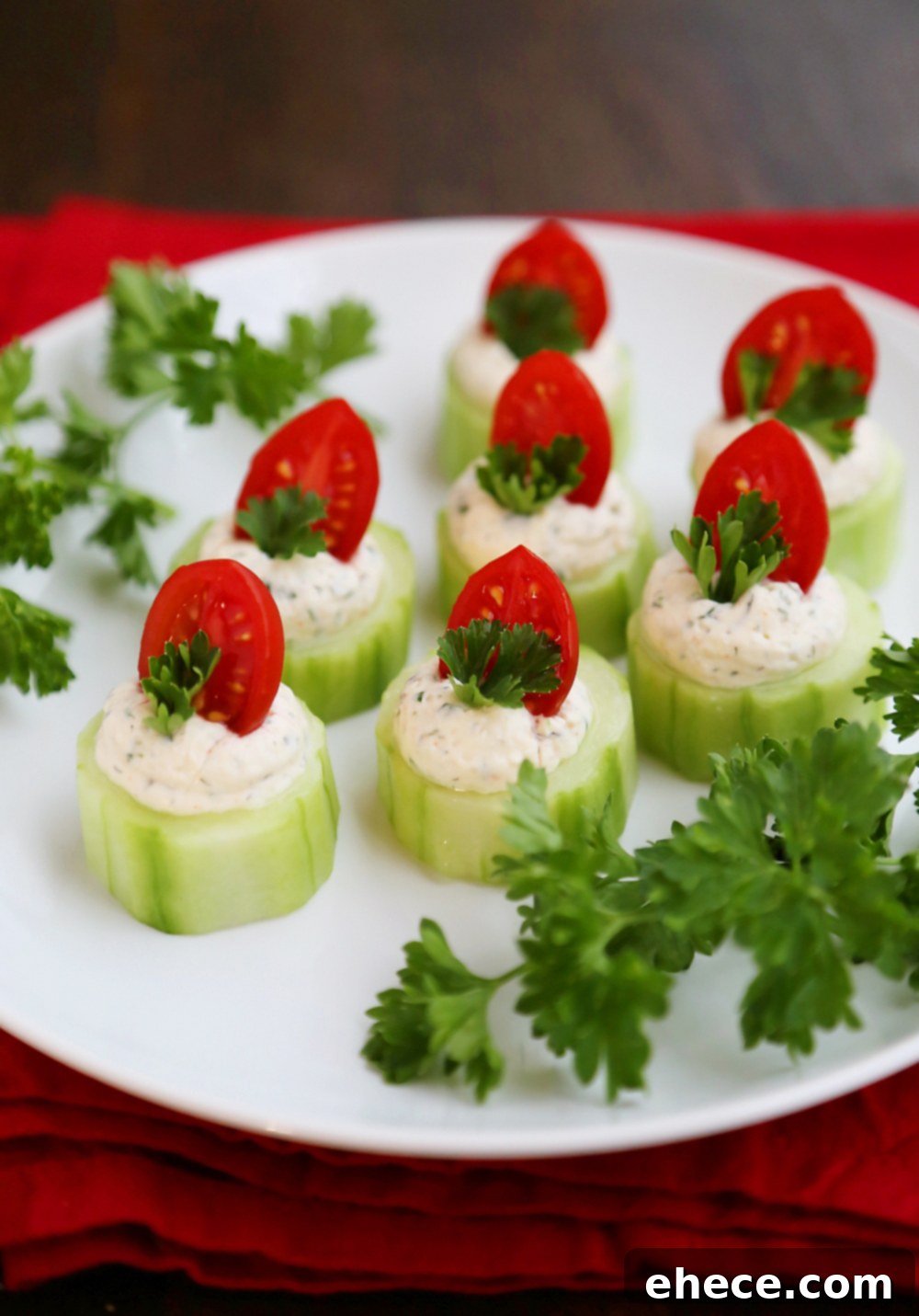 Close-up of Cucumber Tomato Bites with Creamy Parmesan Herb Spread - Showing the vibrant colors and creamy filling, perfect for healthy party food and elegant finger foods.