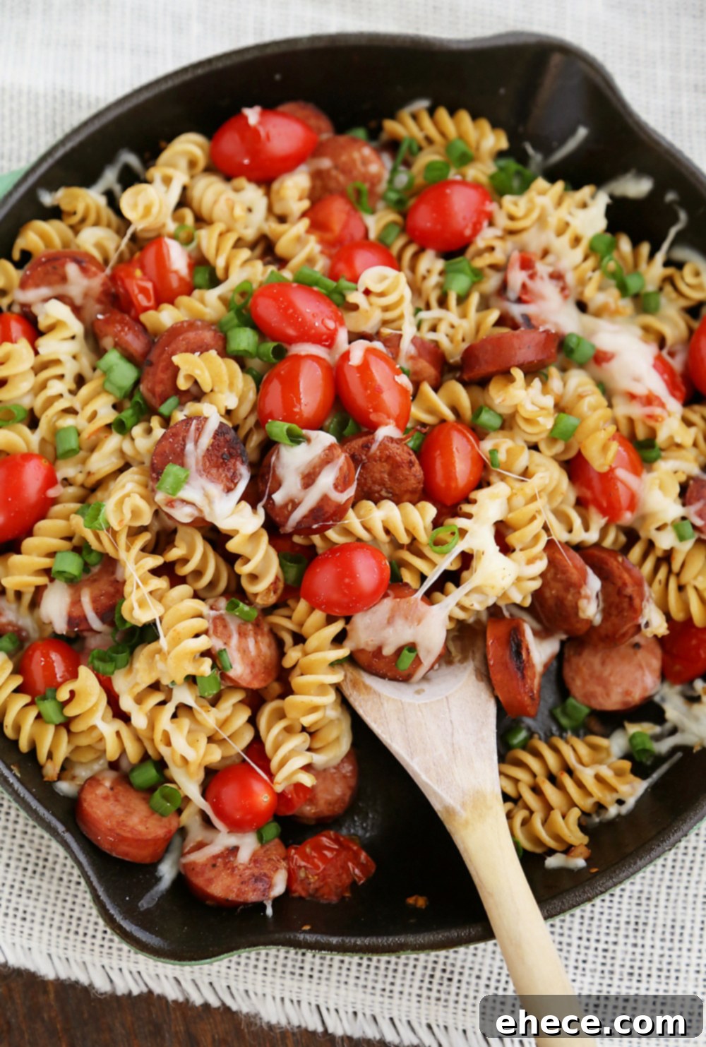 Cheesy Sausage and Tomato Pasta Skillet – This 15-minute dinner is so delicious and easy to whip up on weeknights! Thecomfortofcooking.com