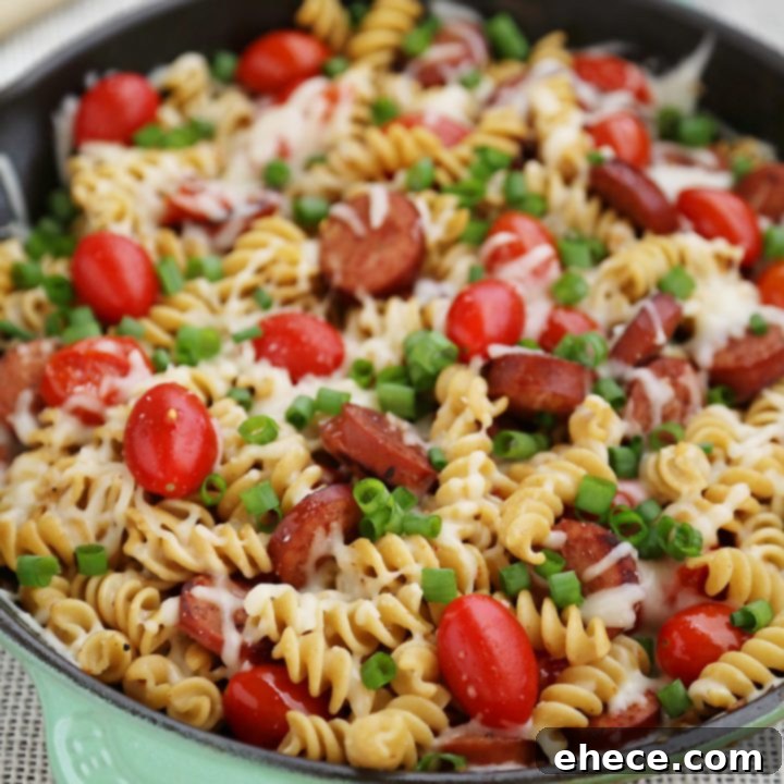 Cheesy Sausage and Tomato Pasta Skillet