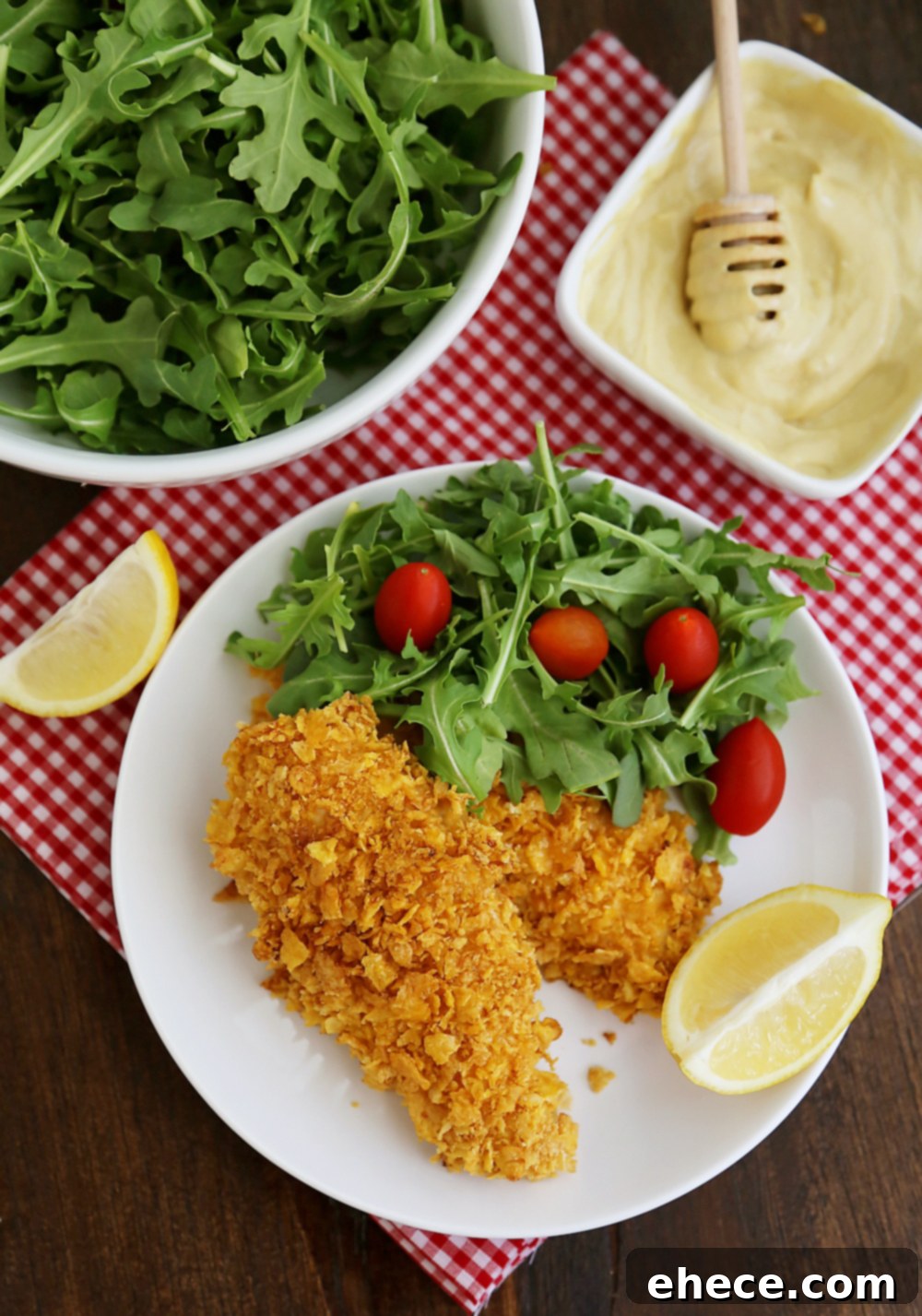 Crunchy Honey-Mustard Baked Chicken Strips 5 Crispy Honey-Dijon Baked Chicken Tenders - Cornflake crusted chicken with honey mustard dipping sauce (recipe included) makes a perfect weeknight meal that kids and adults will love! Thecomfortofcooking.com