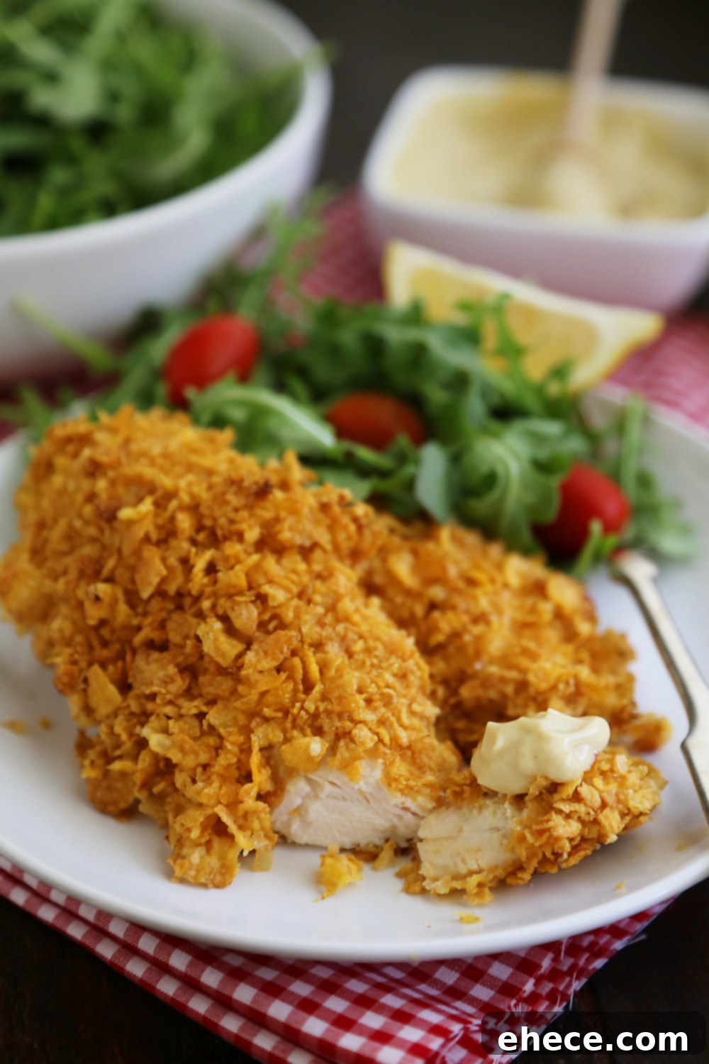 Crunchy Honey-Mustard Baked Chicken Strips 6 Crispy Honey-Dijon Baked Chicken Tenders - Cornflake crusted chicken with honey mustard dipping sauce (recipe included) makes a perfect weeknight meal that kids and adults will love! Thecomfortofcooking.com