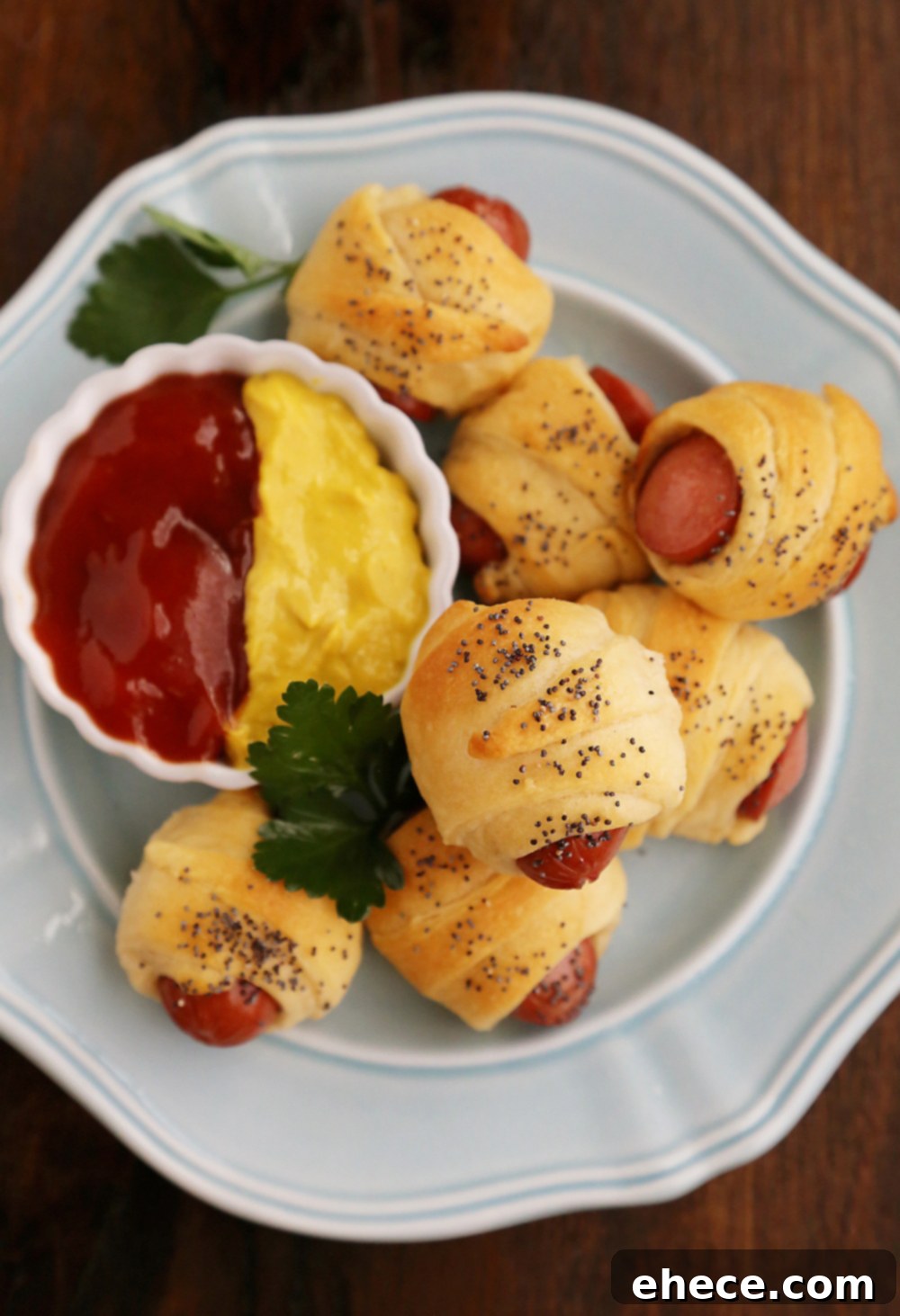 A festive platter of golden 3-Ingredient Crescent Hot Dog Rollups. Perfect mini bites for any party or gathering.