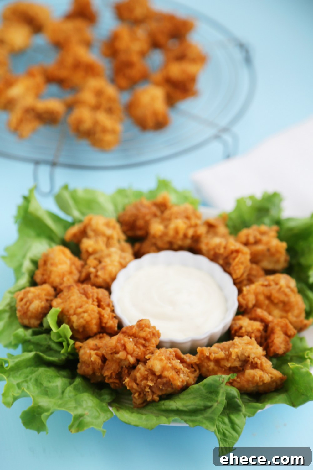 Crispy Buttermilk Popcorn Chicken - Super easy, crispy popcorn chicken made with few ingredients! Serve at parties or for weeknight meals with hot sauce, honey or Ranch dressing. Thecomfortofcooking.com