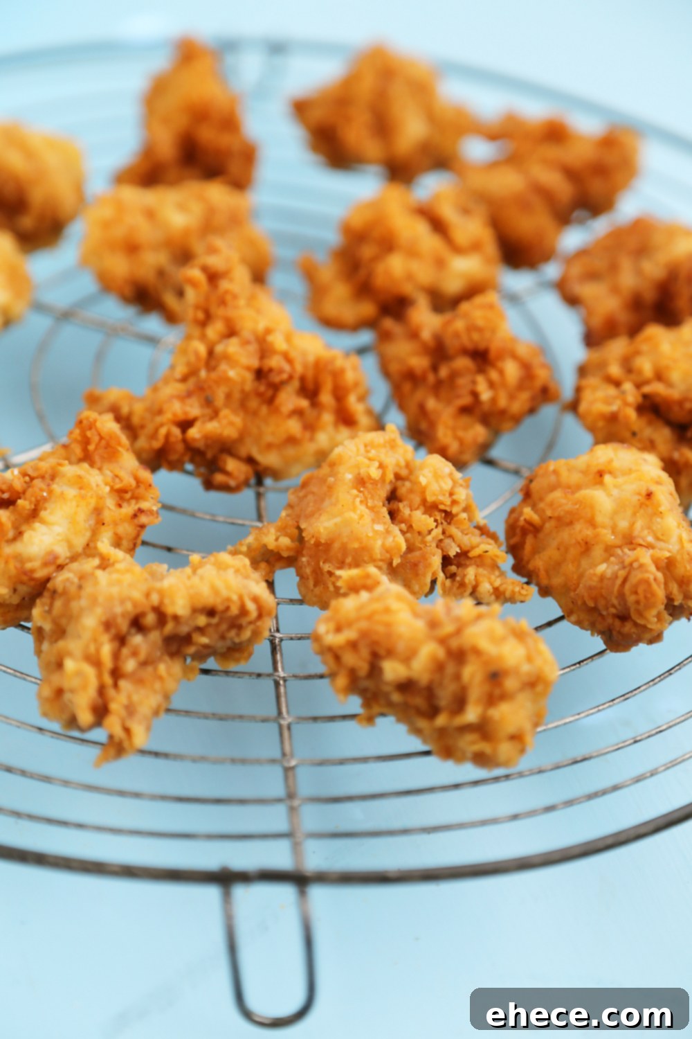 Crispy Buttermilk Popcorn Chicken - Super easy, crispy popcorn chicken made with few ingredients! Serve at parties or for weeknight meals with hot sauce, honey or Ranch dressing. Thecomfortofcooking.com