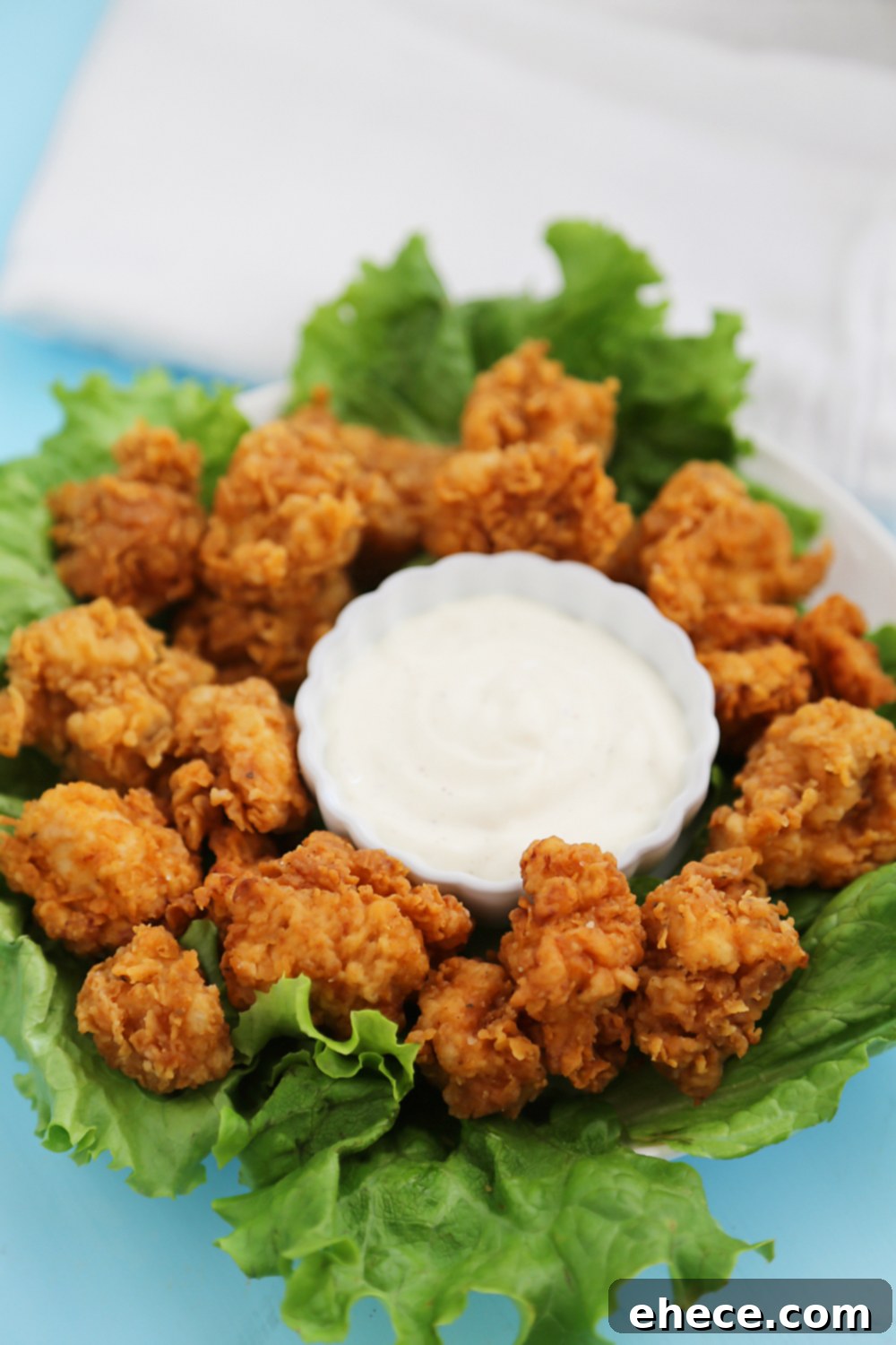 Crispy Buttermilk Popcorn Chicken - Super easy, crispy popcorn chicken made with few ingredients! Serve at parties or for weeknight meals with hot sauce, honey or Ranch dressing. Thecomfortofcooking.com