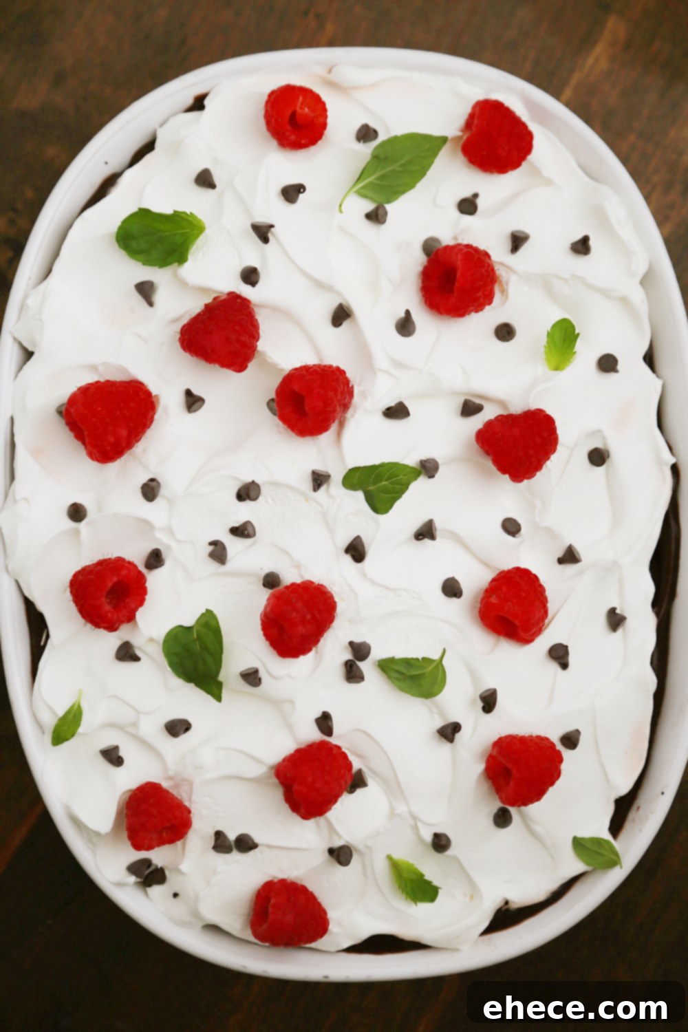 No-Bake Chocolate Layer Dessert - Crumbled cookies, creamy Cool Whip, and chocolate pudding make this the most popular dish at the potluck! Super easy + no-bake! Thecomfortofcooking.com