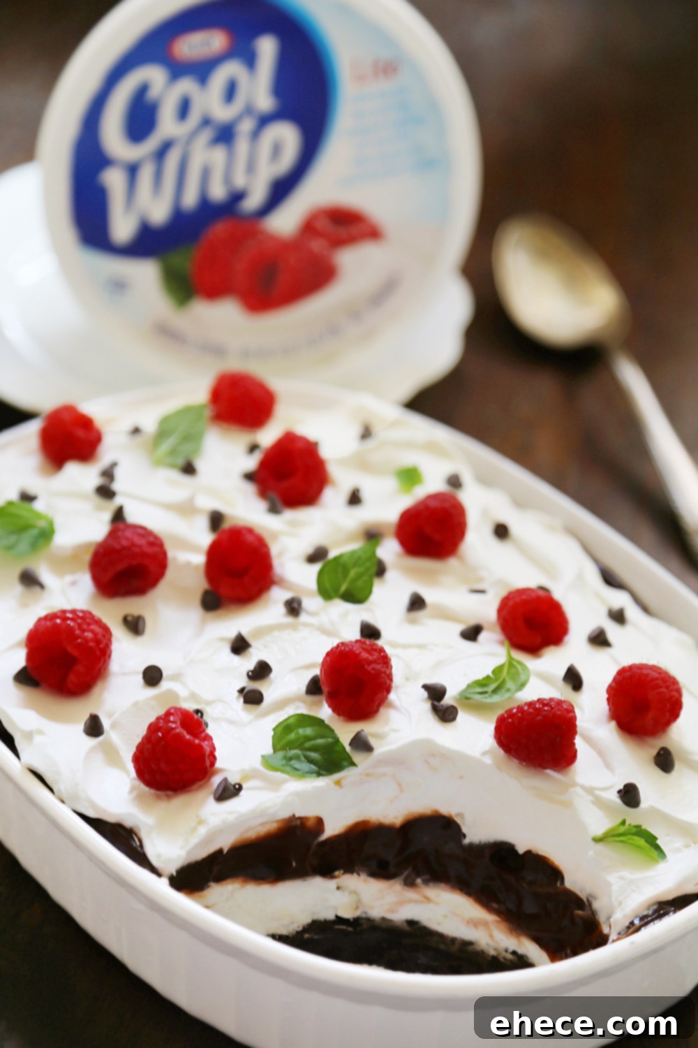 No-Bake Chocolate Layer Dessert - Crumbled cookies, creamy Cool Whip, and chocolate pudding make this the most popular dish at the potluck! Super easy + no-bake! Thecomfortofcooking.com