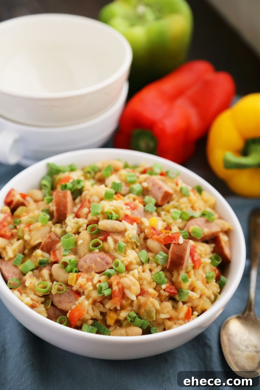 Hearty Cajun Sausage White Bean & Rice Stew 2 Cajun Sausage, White Bean and Rice Stew - A comforting meal easily cooked on your stovetop! Try this simple spiced Cajun stew with @UncleBensRice, sausage, white beans, tomatoes and bell peppers. thecomfortofcooking.com