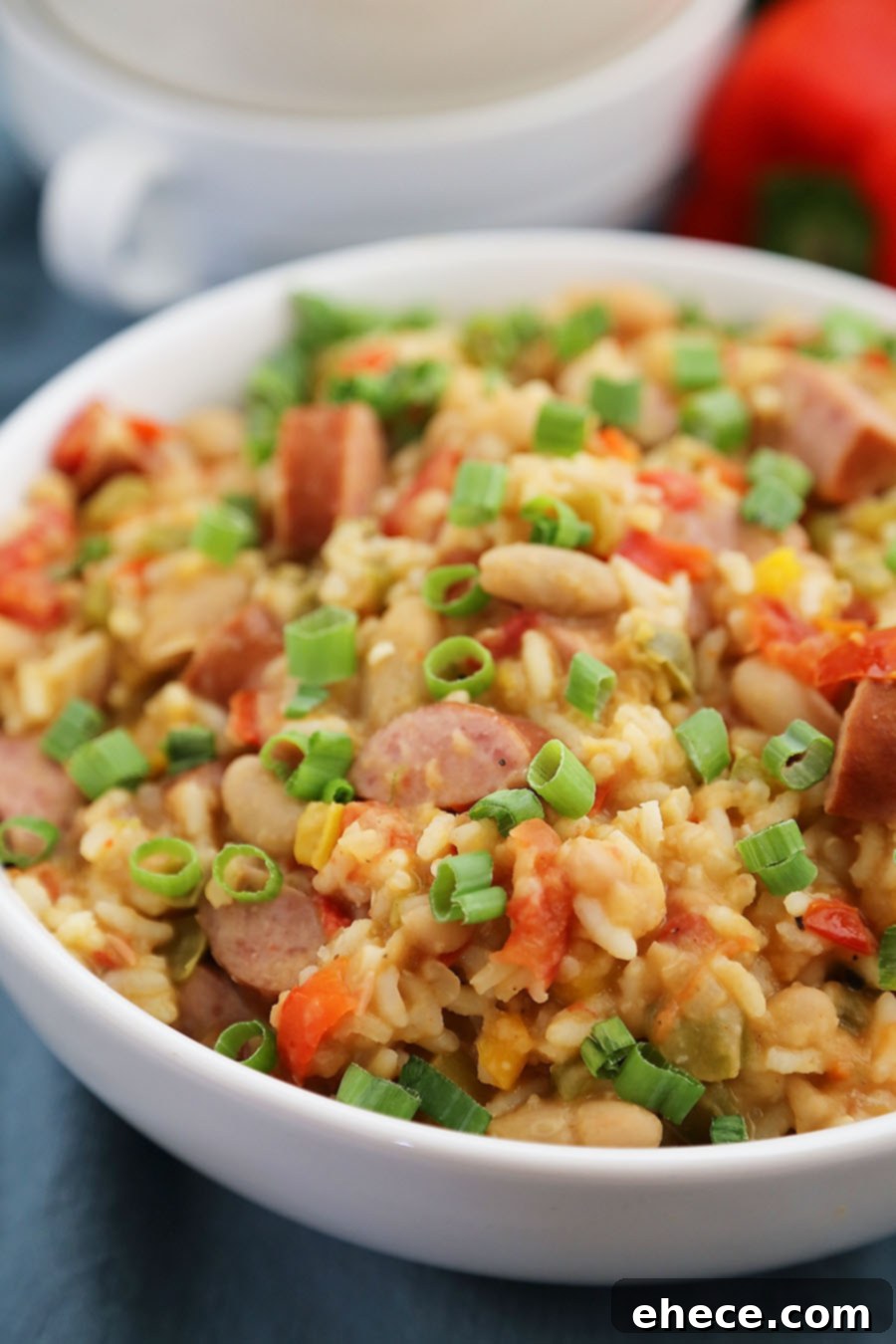 Hearty Cajun Sausage White Bean & Rice Stew 4 Cajun Sausage, White Bean and Rice Stew - A comforting meal easily cooked on your stovetop! Try this simple spiced Cajun stew with @UncleBensRice, sausage, white beans, tomatoes and bell peppers. thecomfortofcooking.com