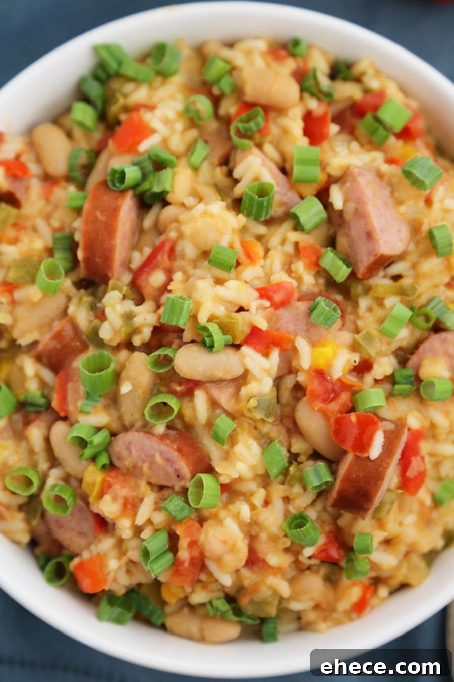 Hearty Cajun Sausage White Bean & Rice Stew 5 Cajun Sausage, White Bean and Rice Stew - A comforting meal easily cooked on your stovetop! Try this simple spiced Cajun stew with @UncleBensRice, sausage, white beans, tomatoes and bell peppers. thecomfortofcooking.com