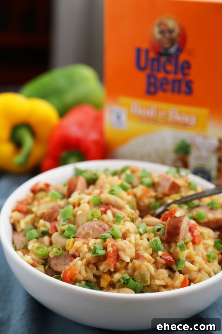 Hearty Cajun Sausage White Bean & Rice Stew 6 Cajun Sausage, White Bean and Rice Stew - A comforting meal easily cooked on your stovetop! Try this simple spiced Cajun stew with @UncleBensRice, sausage, white beans, tomatoes and bell peppers. thecomfortofcooking.com