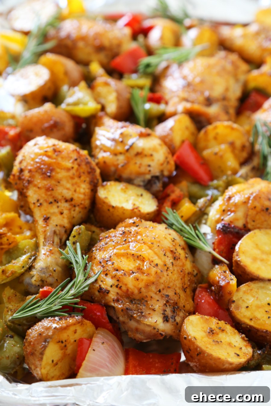 Aromatic Rosemary Chicken with Roasted Peppers & Potatoes 3 Rosemary Roasted Chicken with Bell Peppers and Potatoes - Crispy, tender roasted chicken with bell peppers, potatoes and onions makes an easy one-pan weeknight meal! TheComfortOfCooking.com