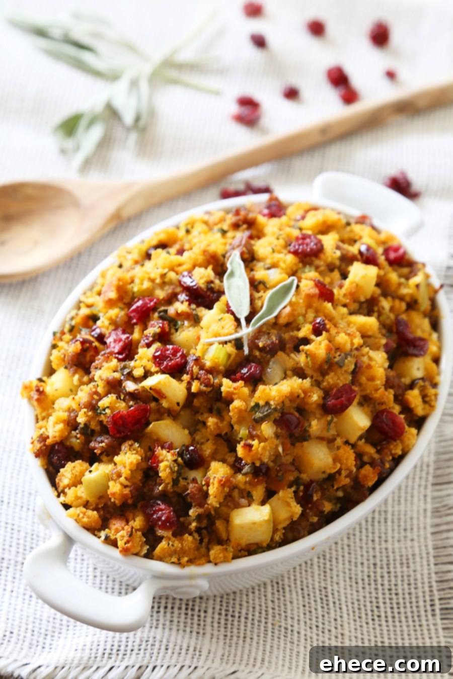 Savory Sausage, Apple, and Cranberry Cornbread Stuffing - the ultimate comfort food for Thanksgiving and beyond.