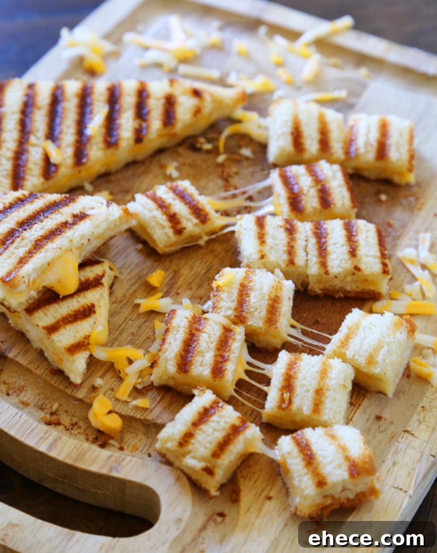 Close-up of golden Grilled Cheese Croutons, tempting and ready to be added to tomato basil soup.