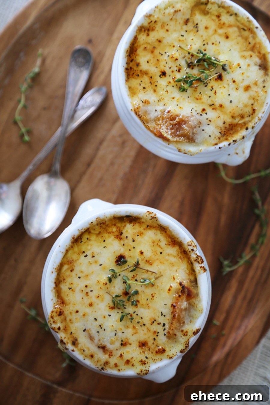 Easy French Onion Soup - Fragrant, cheesy and so comforting! Caramelized onions, beef stock and white (or red) cooking wine mingle into a luxurious medley in this classic French dish.