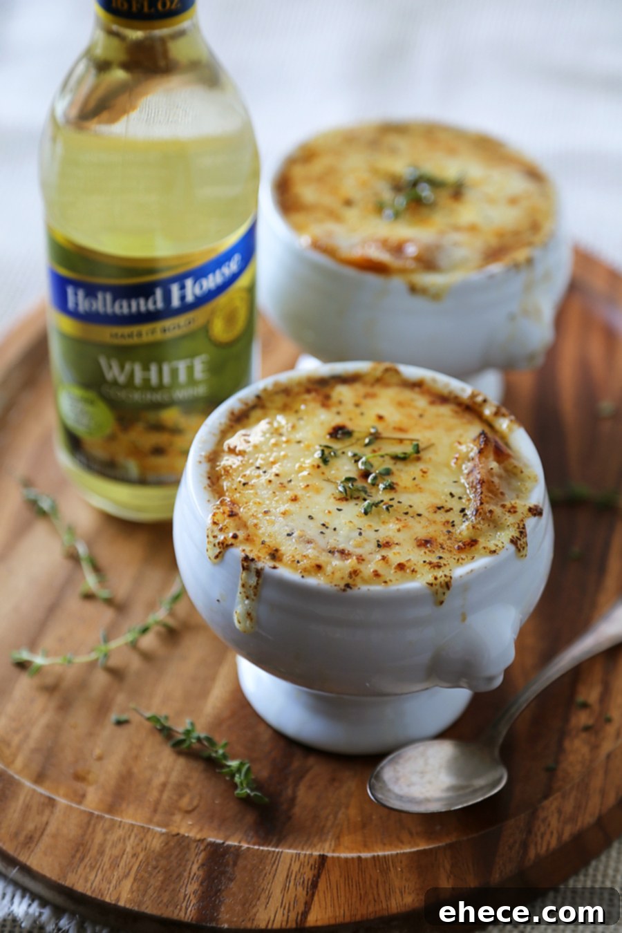 Easy French Onion Soup - Fragrant, cheesy and so comforting! Caramelized onions, beef stock and white (or red) cooking wine mingle into a luxurious medley in this classic French dish.