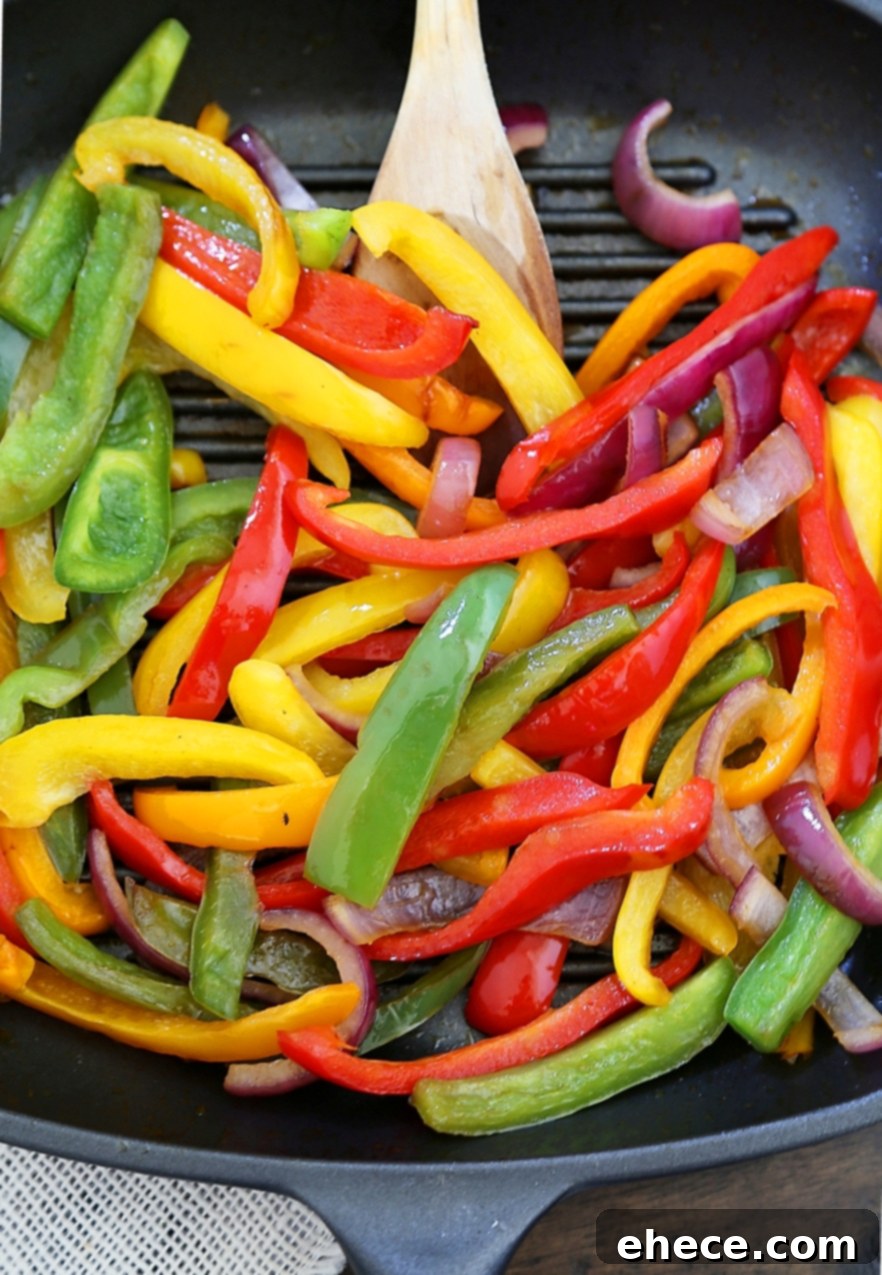 Smoky Chili-Lime Chicken Fajita Bowl 3 Grilled Chili-Lime Chicken Fajita Salad - Tender, juicy marinated chicken with fresh bell peppers, onions, garlic and avocado slices. SO good. Top with some creamy queso fresco and cilantro for extra eye appeal and flavor!