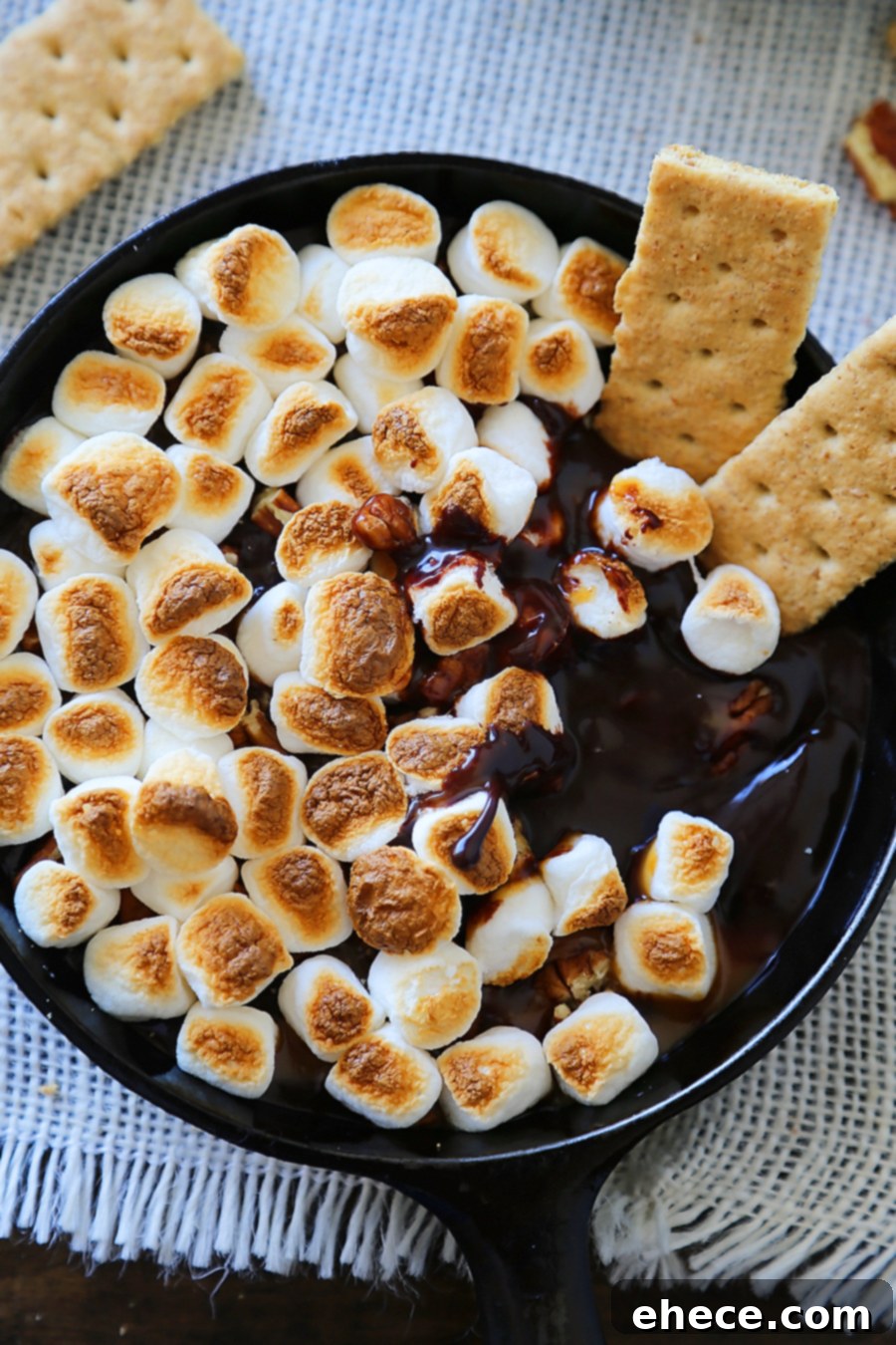 Effortless 5 Ingredient Caramel Pecan Smores Dip 9 5-Ingredient Caramel Pecan S'mores Dip - Perfect for parties! Loaded with creamy caramel and pecans, this treat is super quick and easy! thecomfortofcooking.com