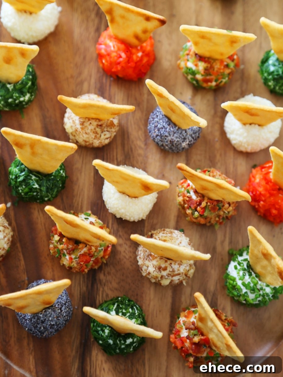 3-Ingredient Mini Queso Cheese Balls - The BEST quick and easy appetizer! Roll in chives, bacon, jalapeno, cranberries, nuts or veggies + top with pita chips! Thecomfortofcooking.com