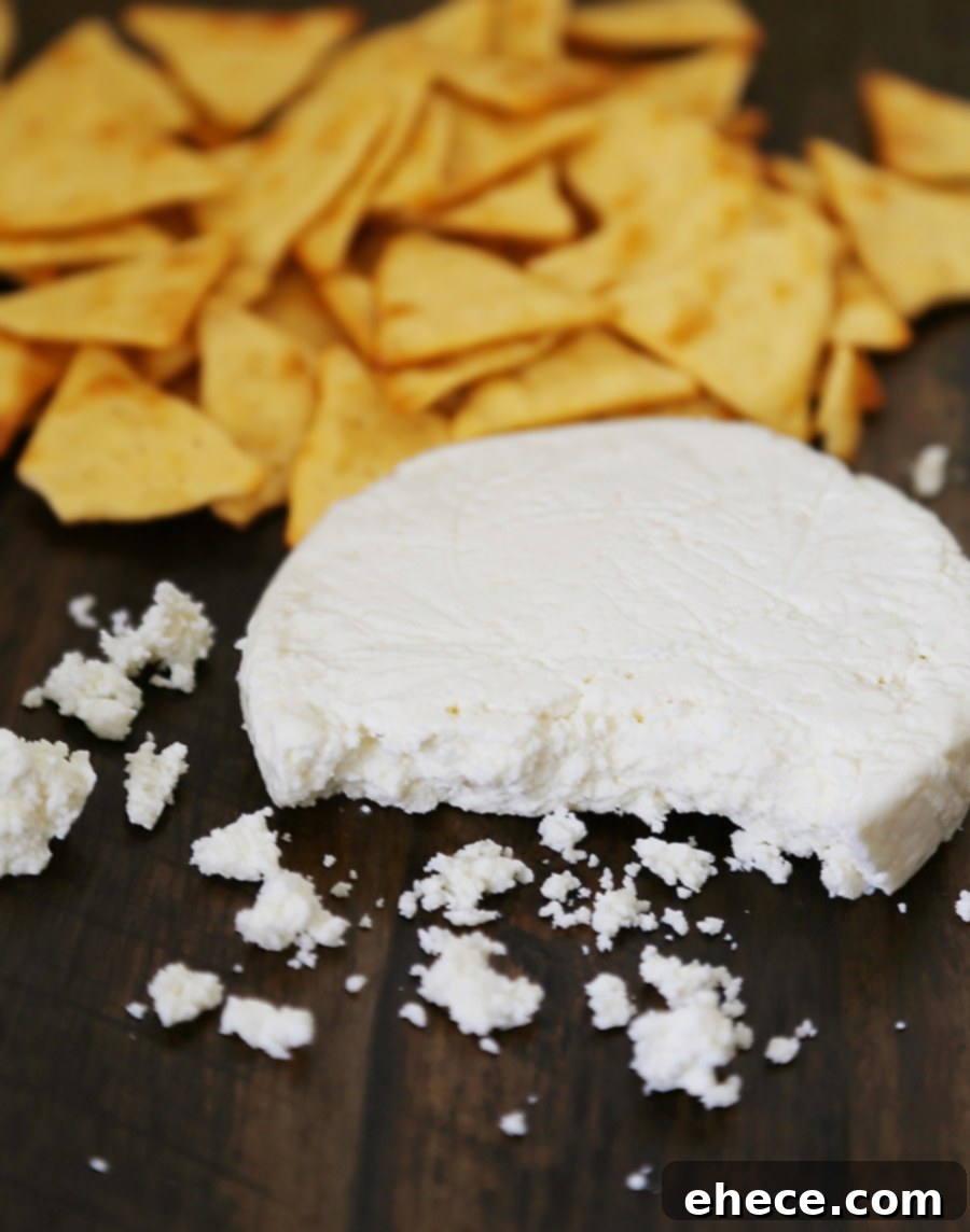 3-Ingredient Mini Queso Cheese Balls - The BEST quick and easy appetizer! Roll in chives, bacon, jalapeno, cranberries, nuts or veggies + top with pita chips! Thecomfortofcooking.com