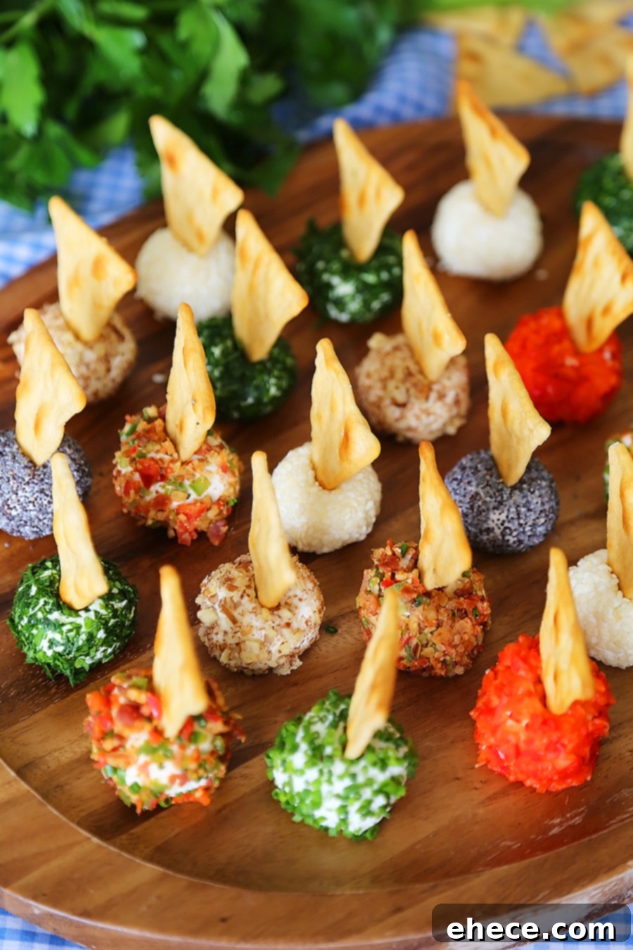 3-Ingredient Mini Queso Cheese Balls - The BEST quick and easy appetizer! Roll in chives, bacon, jalapeno, cranberries, nuts or veggies + top with pita chips! Thecomfortofcooking.com