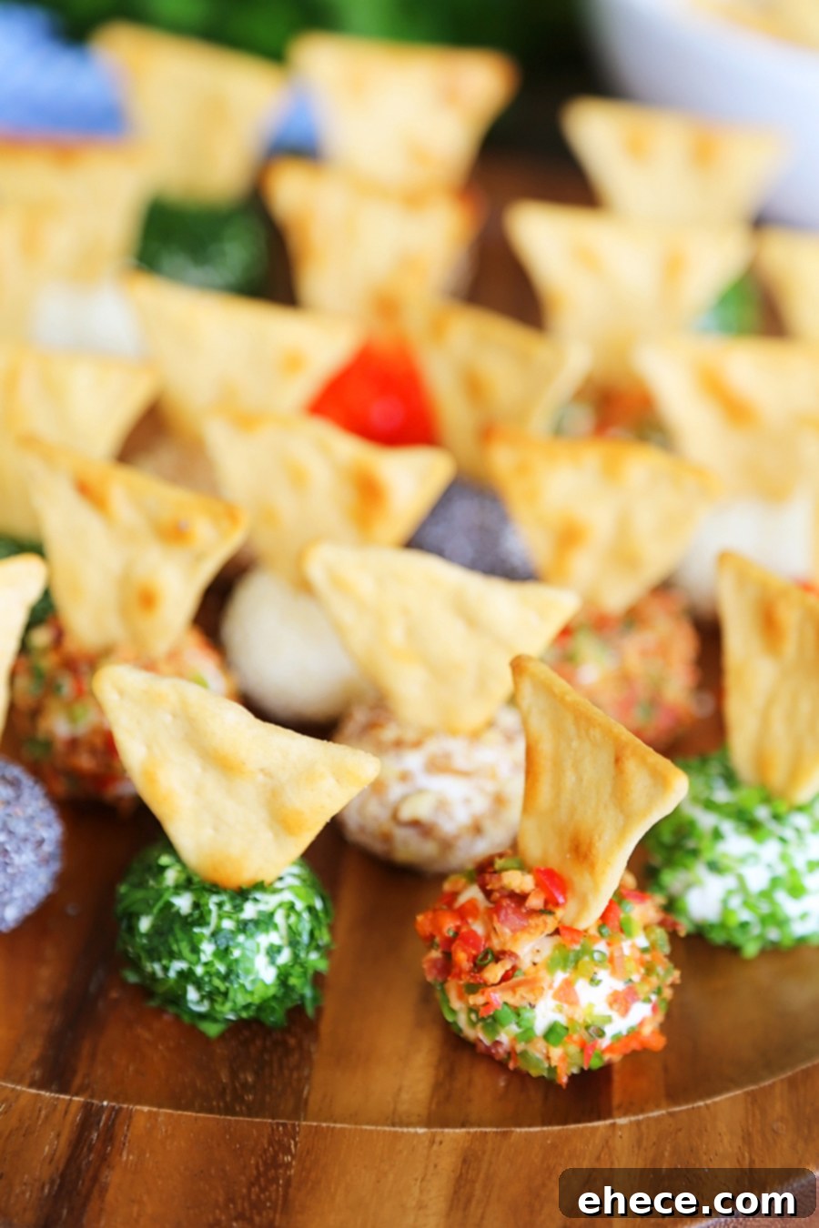 3-Ingredient Mini Queso Cheese Balls - The BEST quick and easy appetizer! Roll in chives, bacon, jalapeno, cranberries, nuts or veggies + top with pita chips! Thecomfortofcooking.com