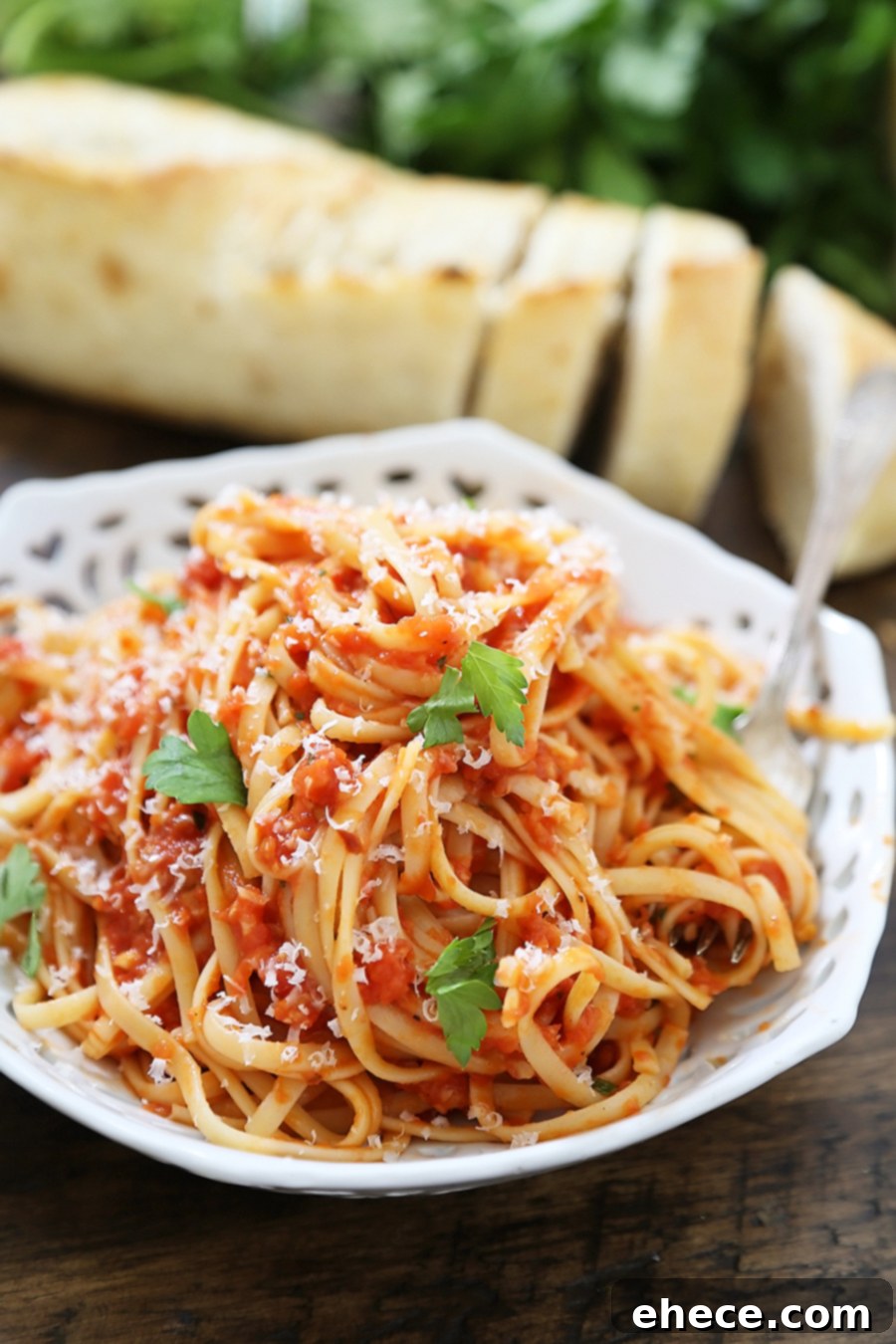 Delicious 5-Ingredient Butter Roasted Tomato Sauce with Linguine, topped with fresh Parmesan cheese