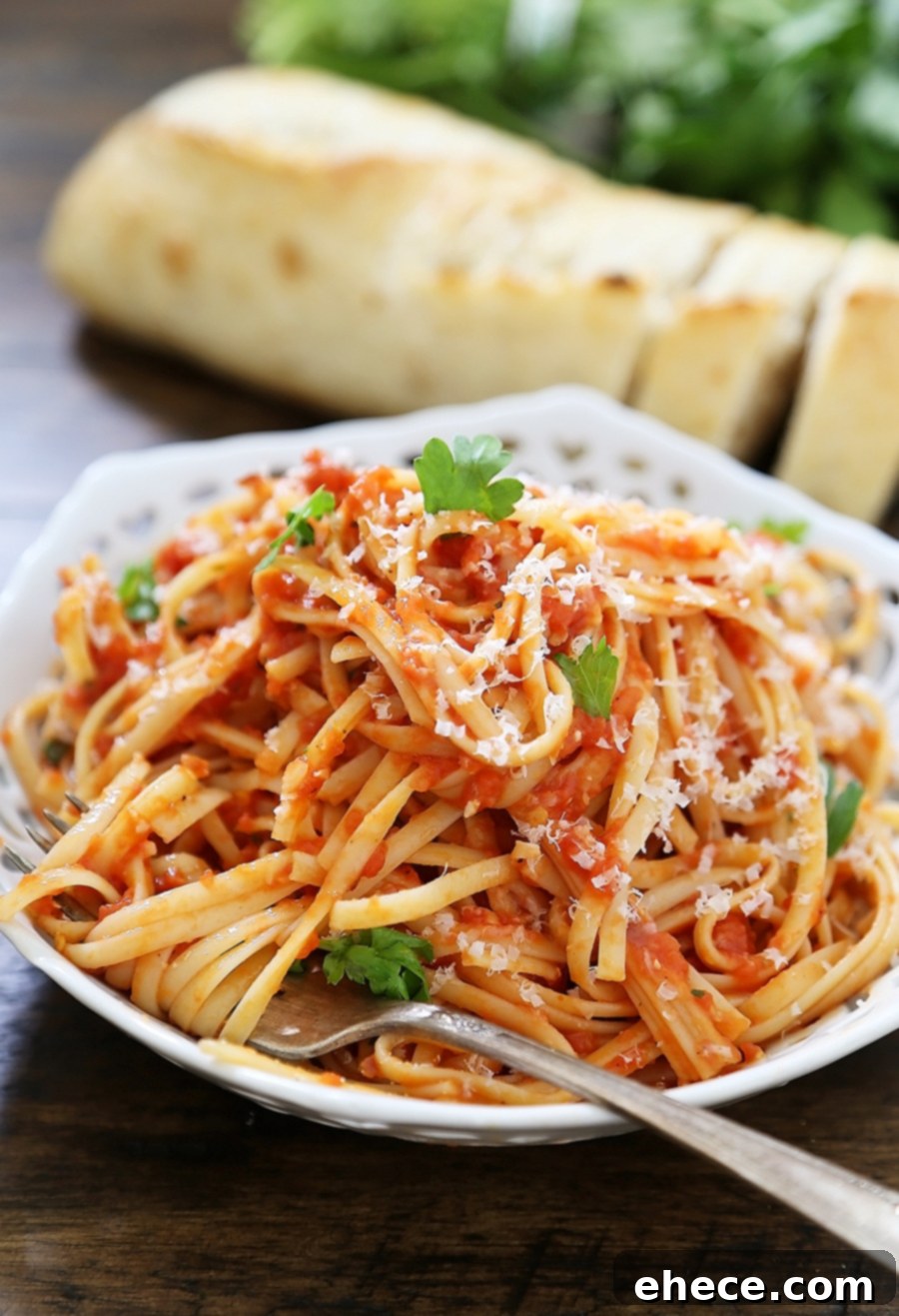 A closer look at the delicious butter roasted tomato pasta, garnished with herbs
