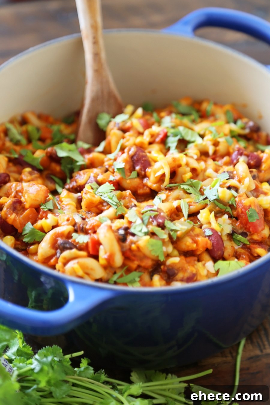 Hearty One-Pot Vegetarian Chili Mac and Cheese 3 One-Pot Cheesy Vegetarian Chili Mac 'n Cheese - Super cheesy, comforting and easy to make for meatless weeknights with family! Full of fresh veggies, beans, tomatoes and tender pasta! Thecomfortofcooking.com