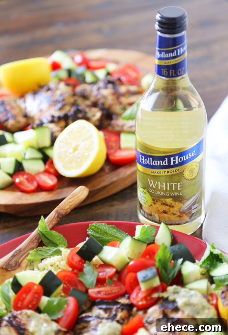 Greek Tahini Chicken with Cucumber, Tomato and Lemon Orzo Salad - Smoky, tender marinated chicken thighs with a creamy tahini sauce, fresh veggies, orzo and a squeeze of lemon! Full of nutritious, hearty goodness! Thecomfortofcooking.com