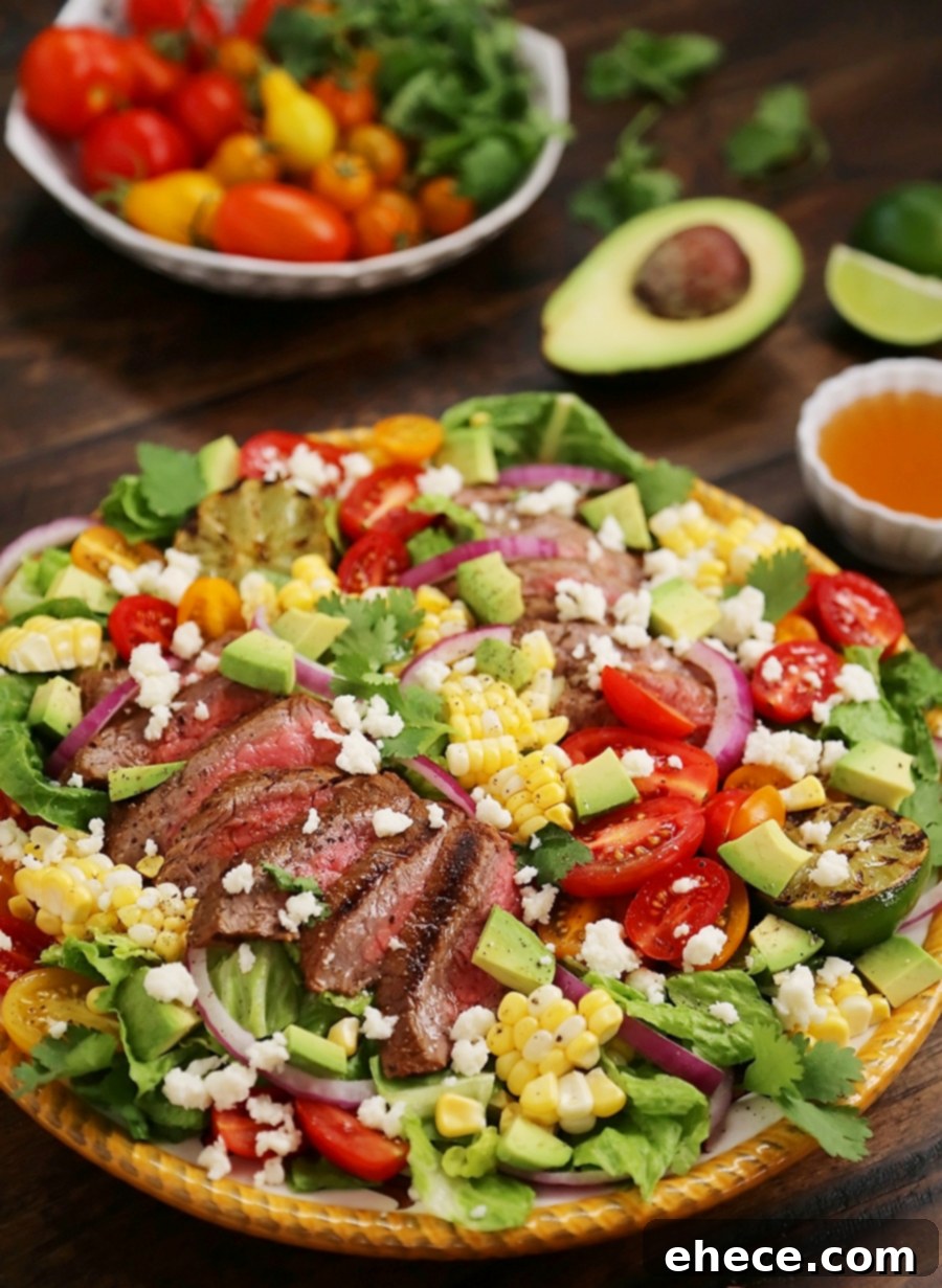 Mexican Grilled Steak Salad with Honey Lime Dressing - Smoky, spicy steak, fresh corn, red onions, creamy avocado and a zesty honey lime dressing. Full of flavor, color and nutritious goodness! Thecomfortofcooking.com