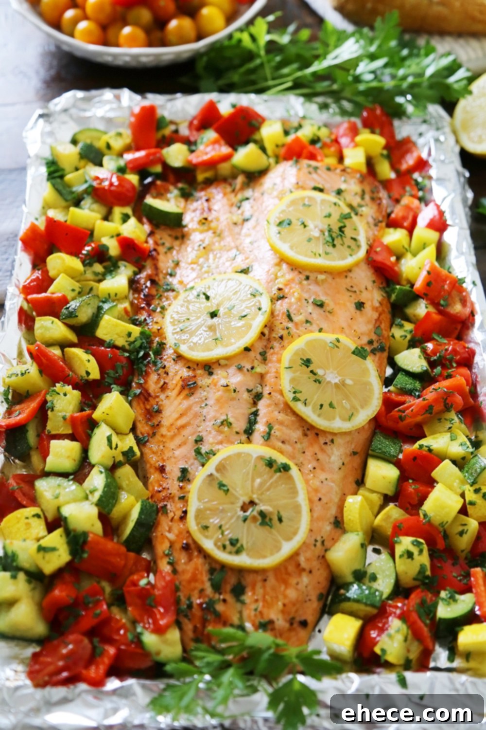 Lemon Garlic Honey Butter Salmon Veggie Foil Packs 3 Lemon-Garlic Honey Butter Salmon & Veggies in Foil - Juicy, flaky roasted salmon with lemon-garlic honey butter and tender summer veggies! One pan full of hearty, healthy goodness! thecomfortofcooking.com
