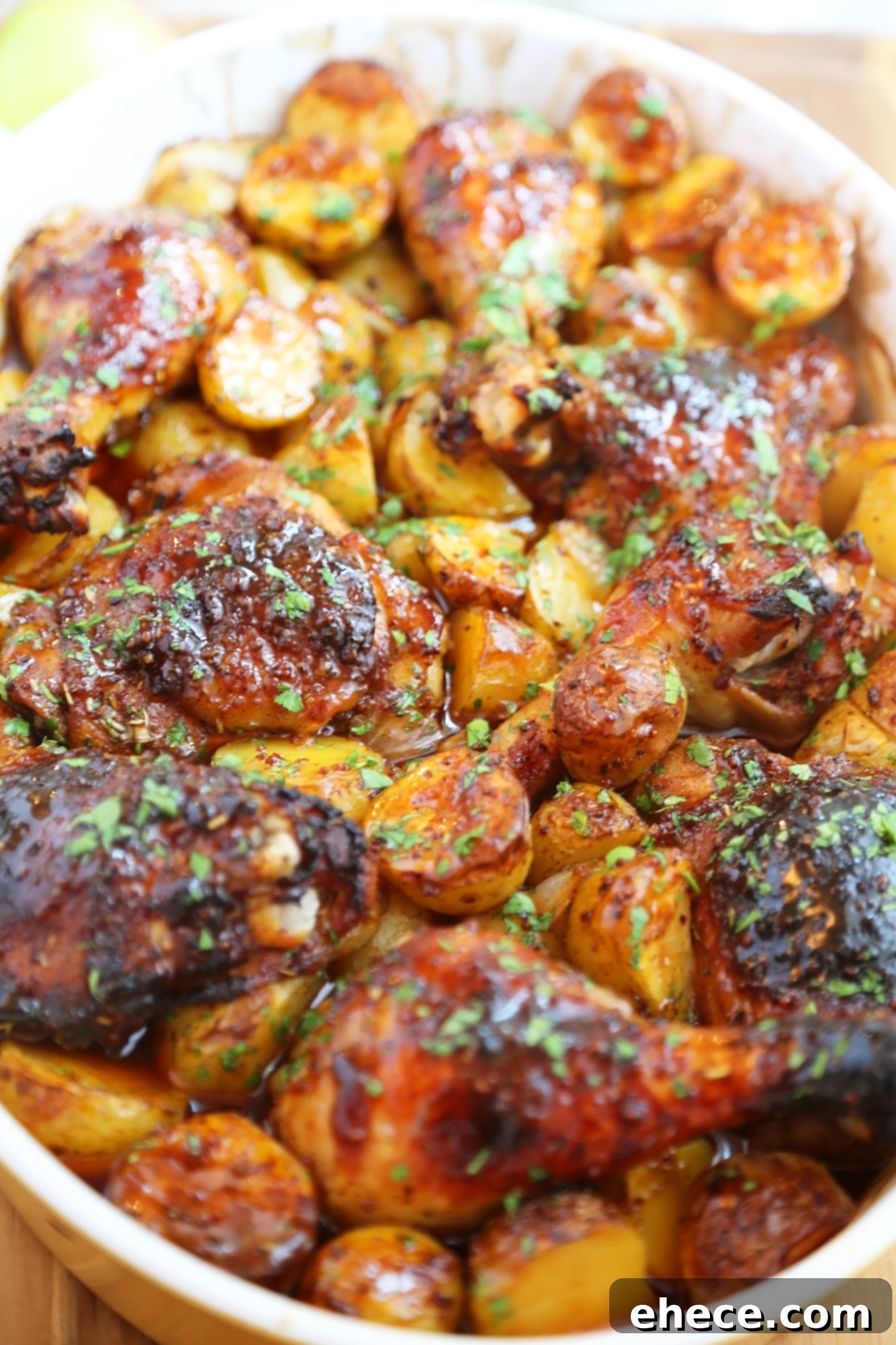 Small saucepan on a stovetop with the apple cider glaze bubbling gently, a whisk resting nearby.