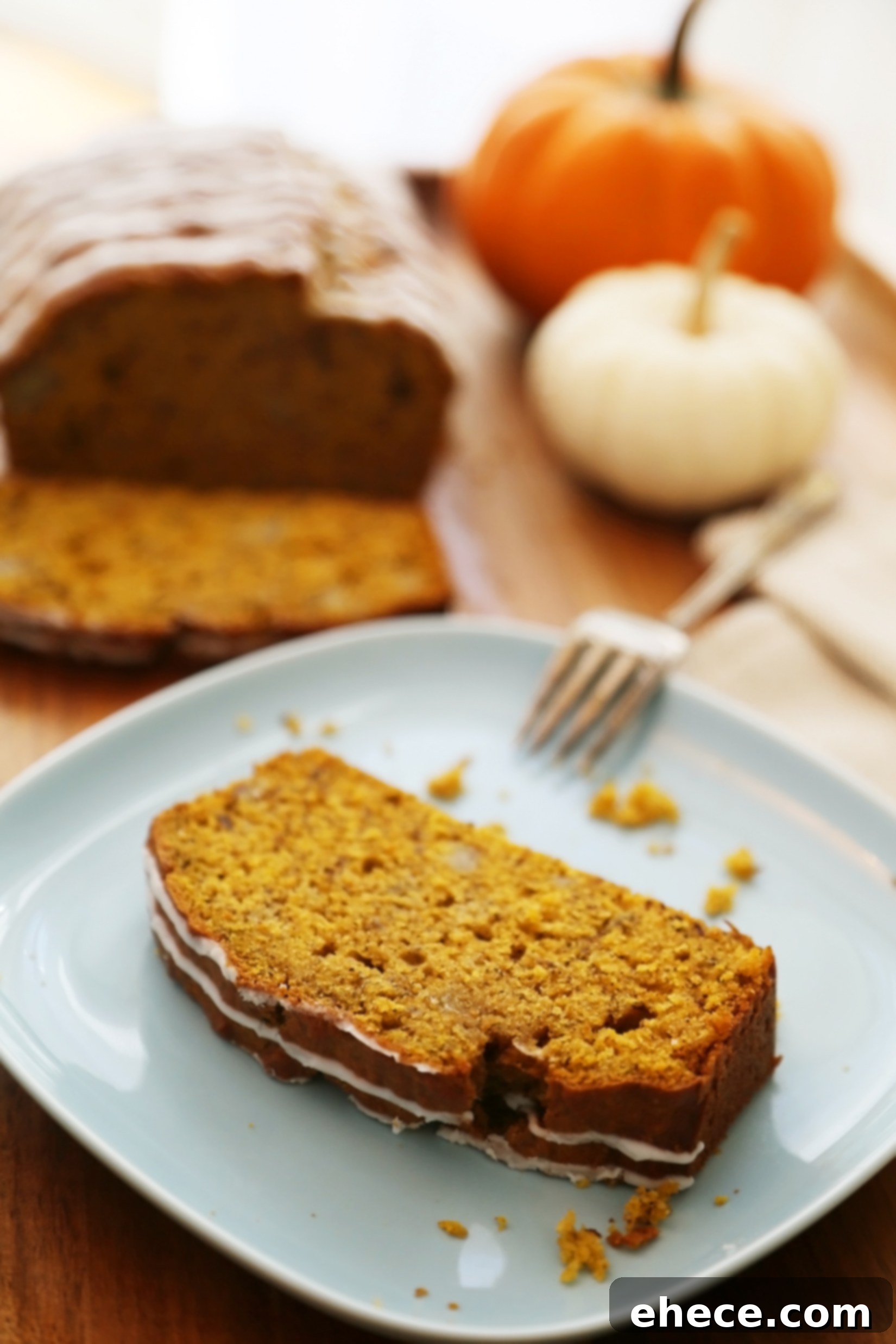 Autumn Pumpkin Banana Bread with Vanilla Drizzle 6 Full loaf of Super Moist Pumpkin Banana Bread with Vanilla Glaze on a cooling rack, ready to be enjoyed.