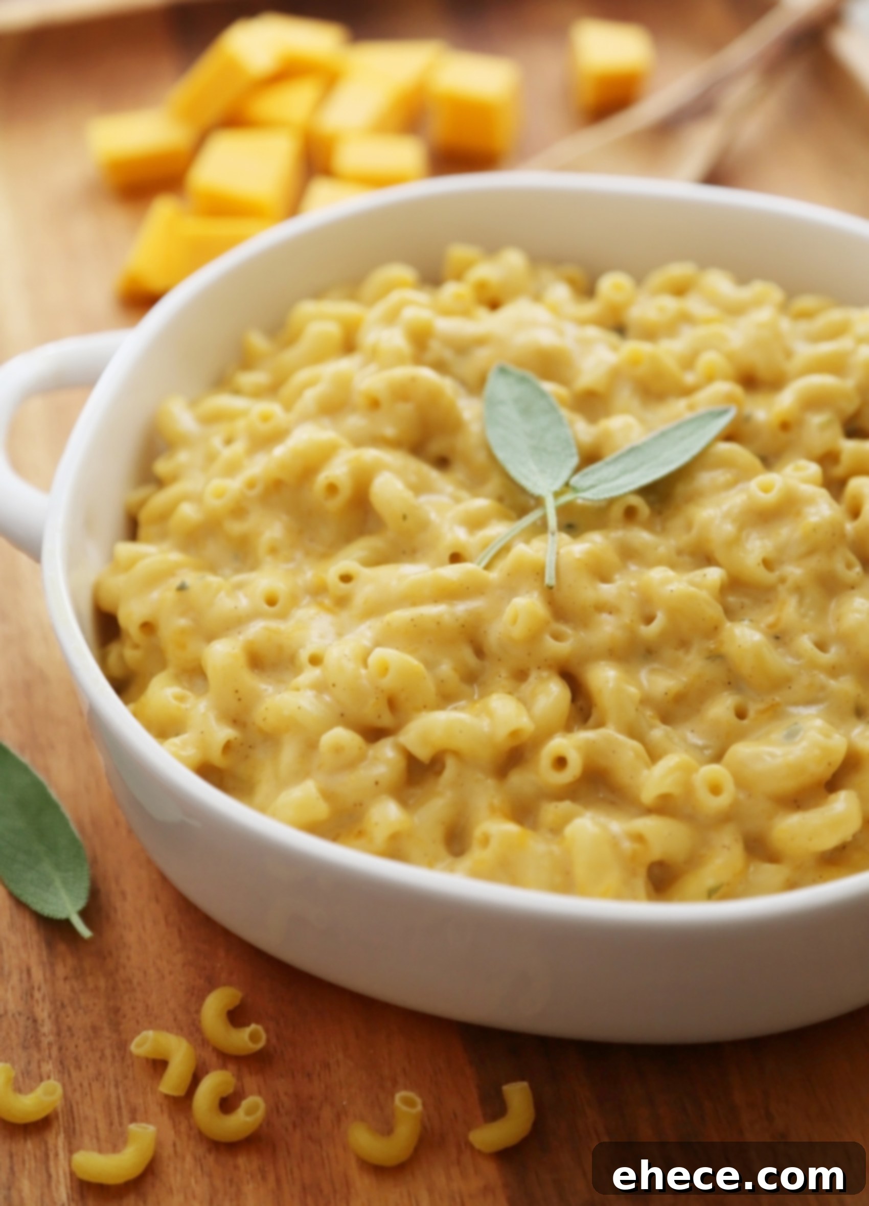 Creamy Butternut Squash Mac and Cheese in a rustic bowl, garnished with fresh herbs