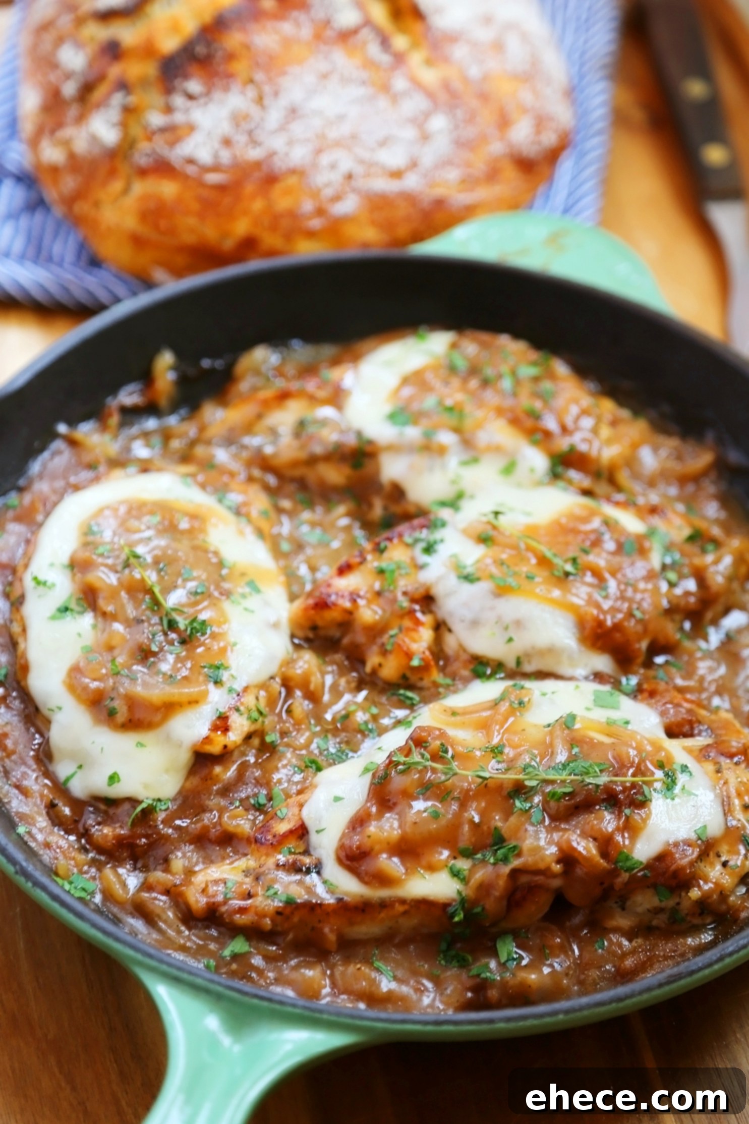 Skillet French Onion Chicken - Saucy, melt-in-your-mouth French onion chicken smothered in caramelized onion gravy, topped with melted cheese.