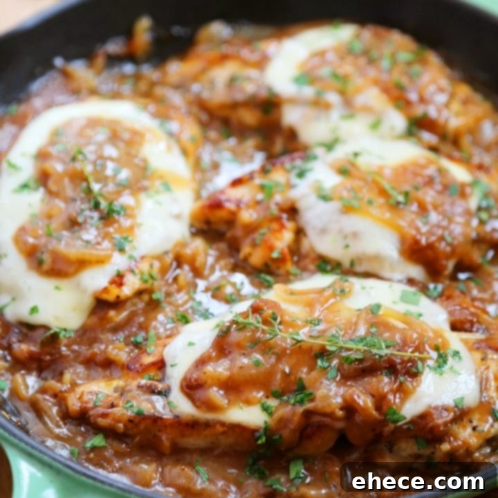 Skillet French Onion Chicken - Saucy, melt-in-your-mouth French onion chicken smothered in caramelized onion gravy, topped with melted cheese.
