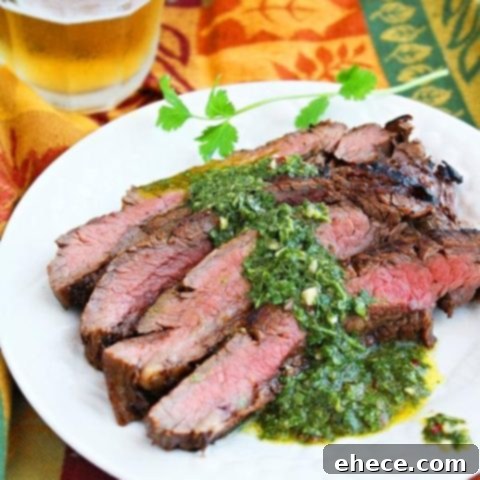 Grilled Flank Steak with Chimichurri Zing 3 Grilled Marinated Flank Steak with Chimichurri Sauce, served on a plate
