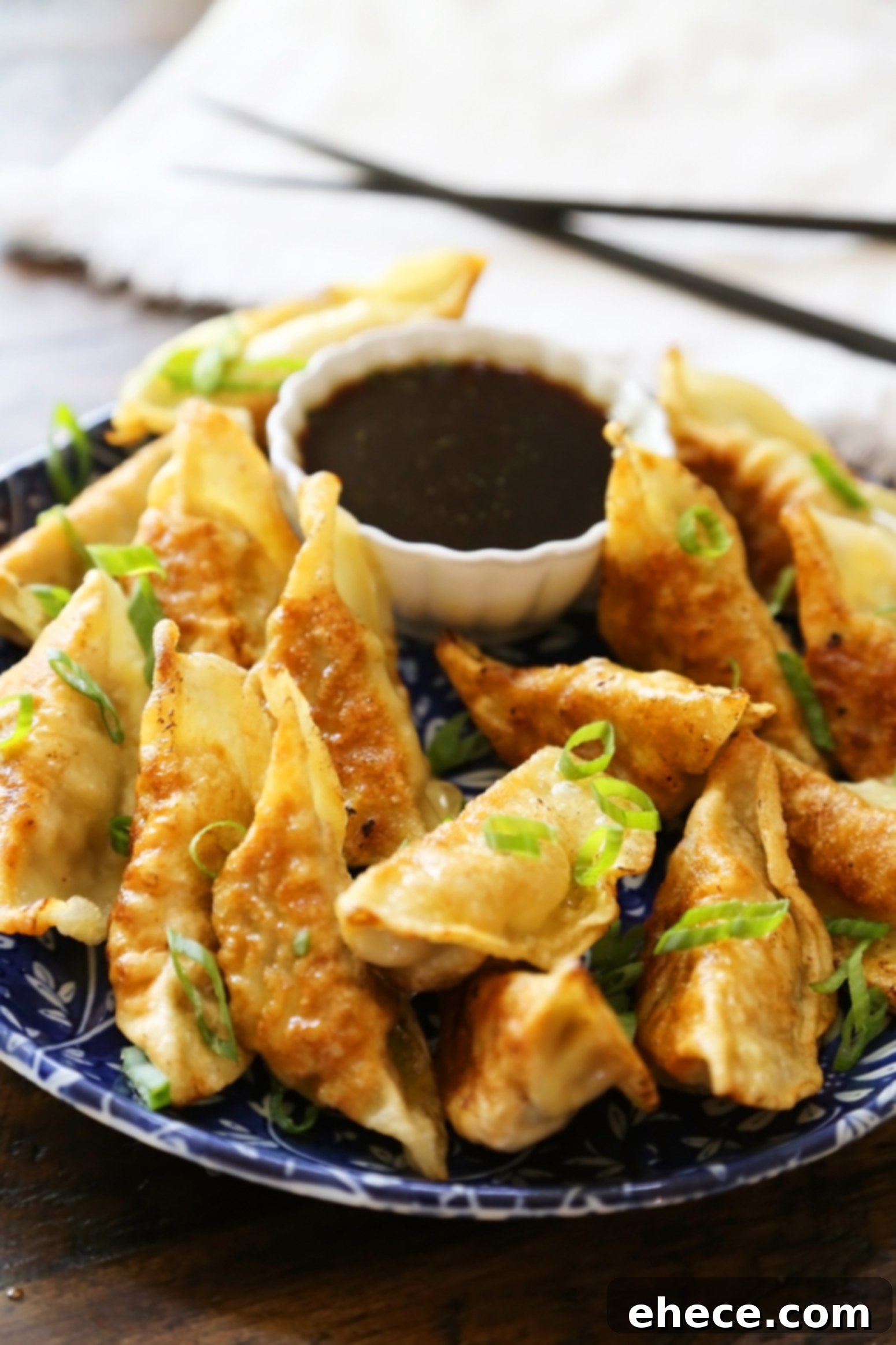Simple Asian Dumplings with Zesty Soy Ginger Dip 5 Easy Asian Dumplings with Soy-Ginger Dipping Sauce - Crispy, tender steamed potstickers, made easily in one skillet! A selection of fresh ingredients for the dipping sauce, including ginger, garlic, and green onions.