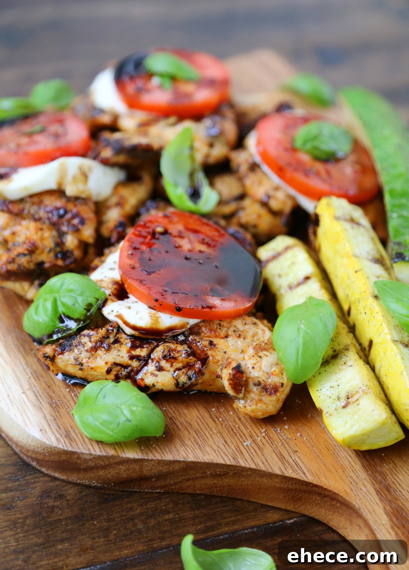 Vibrant Caprese Chicken with Grilled Summer Squash 5 Grilled Caprese Chicken being artfully drizzled with balsamic vinegar