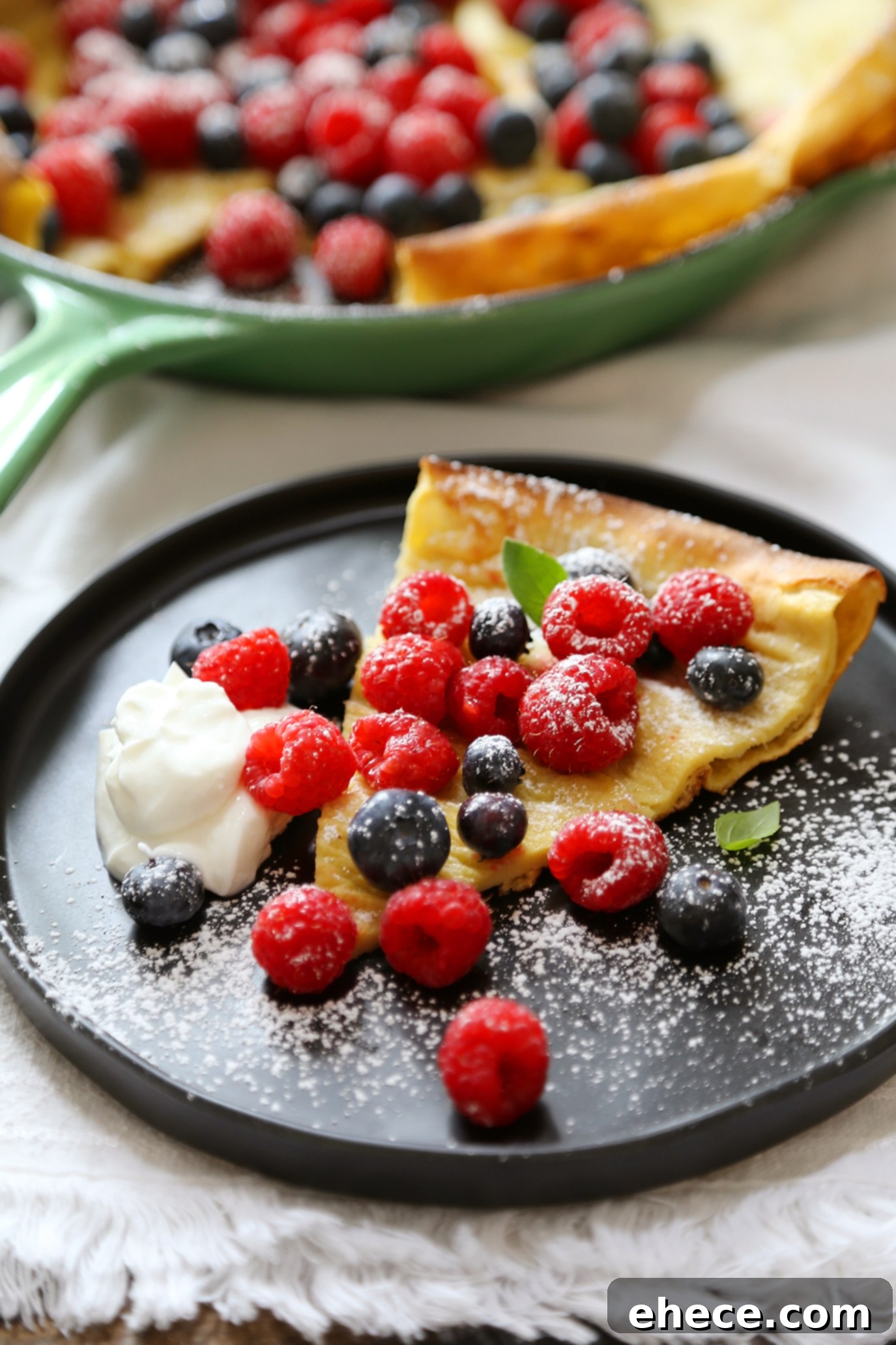 Close-up of the crispy, golden edges of a Dutch Baby Pancake